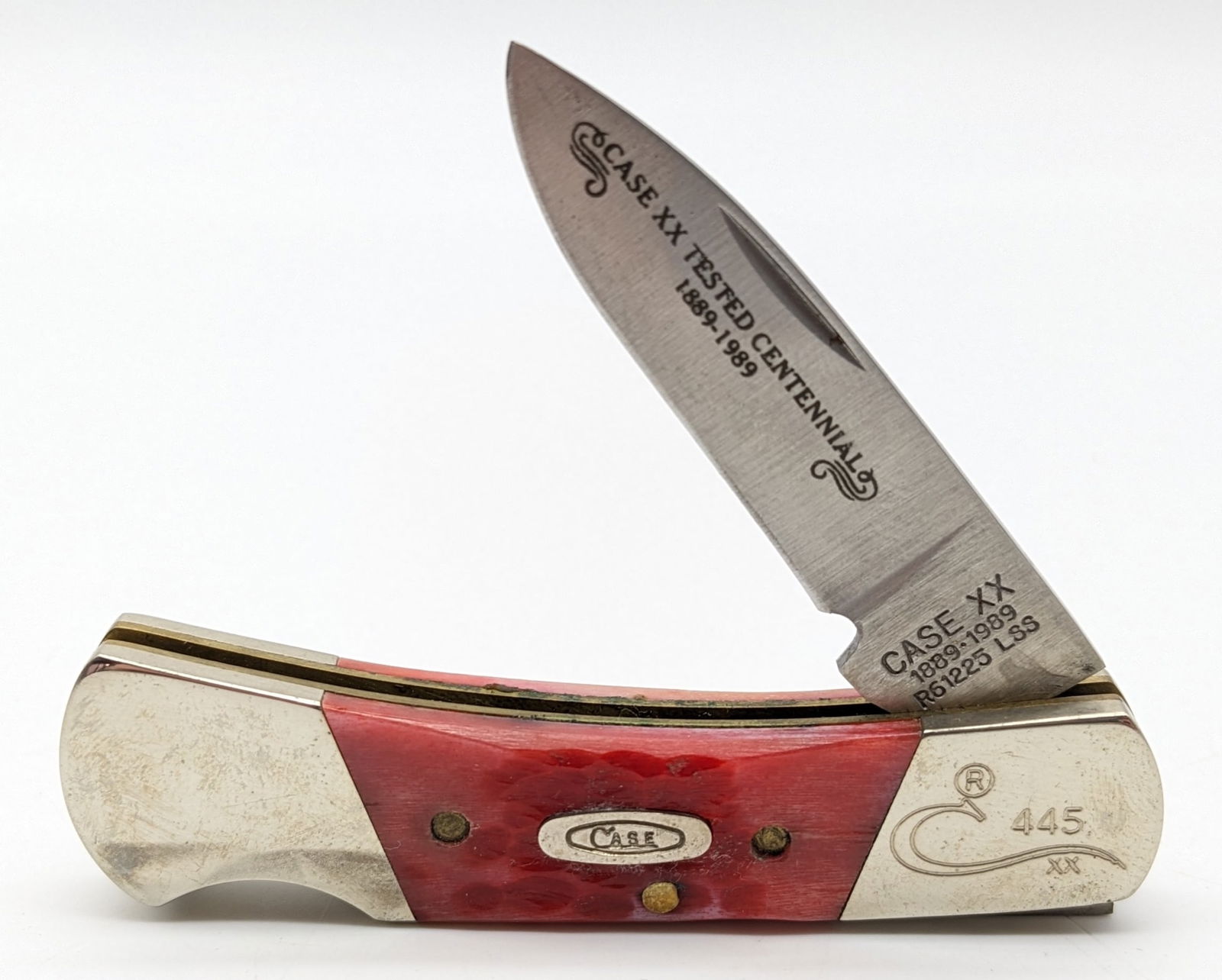 Ltd 1989 Case XX Centennial Red Bone Lock Back Knife R61225: Ltd 1989 Case XX Centennial Red Bone Lock Back Knife R61225. Knife is numbered 445 on the upper front bolster, and is in very nice condition with minimal wear from handling. Overall measures 3in when