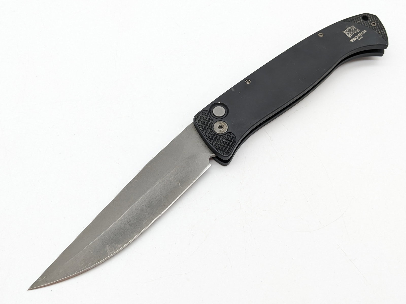 ProTech Brend #1 Trailing Point Switchblade Auto Knife: Knife features a black anodized aluminum handle, and a satin finish trailing point blade. Knife appears to be in unused condition, but has some wear on the handle from carrying and handling. Overall m