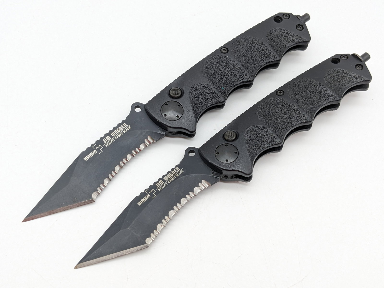 (2) Boker Plus Jim Wagner RBB Switchblade Auto Knives: Knives feature DLC black partially serrated tanto blades, black composite finger groove handles, and glass breaker pommels. Knives are in unused condition, but one of the springs does not work. Overal