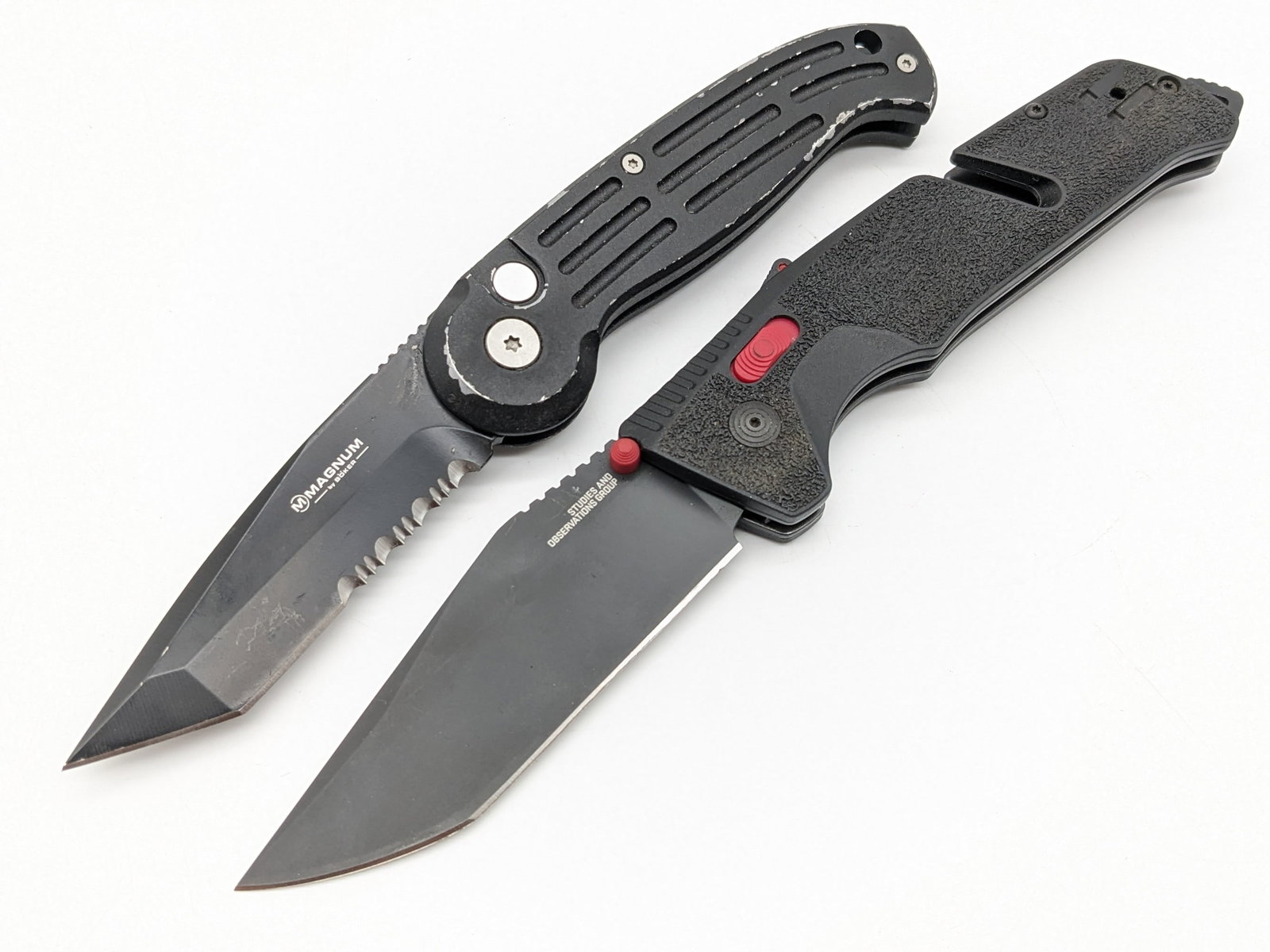 SOG Trident AT Cryo 02 & Boker Magnum Switchblade Auto Knives: The SOG knife is in very nice condition with minimal wear from handling, but the Boker has heavy finish wear on the handle and the mechanism is sticky. Largest overall measures 5-1/2in when closed.