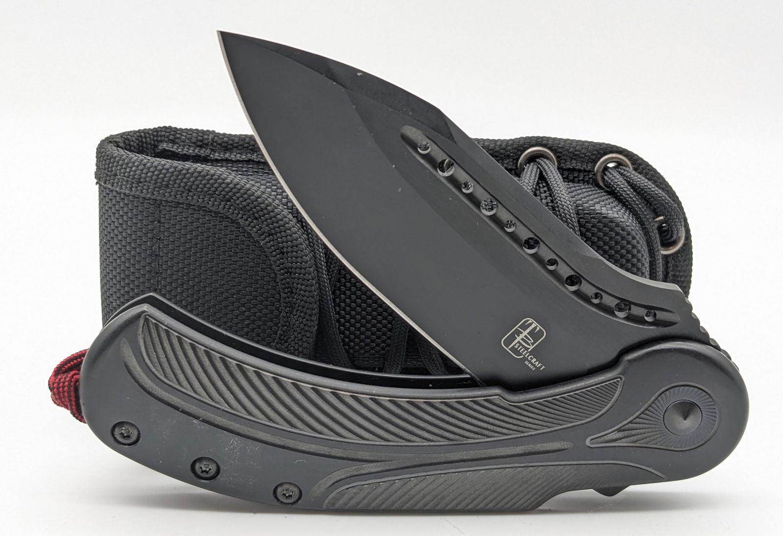 Todd Begg Steelcraft Series Field Marshall Flipper Folding Knife w/ Case: Features a black finish drop point blade with thumb notches, black finish milled titanium handle scales, and a matching black finish titanium pocket clip with a ceramic ball. Knife is in like new cond