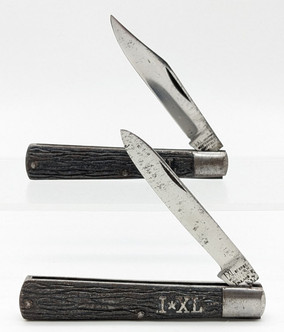 IXL George Wostenholm Metal Handle Jack Knives: Knives are in aged condition with scuffs and carbon spots on the blades, and scattered wear on the worm jig pattern metal handles. Overall measures 3-1/4in when closed.