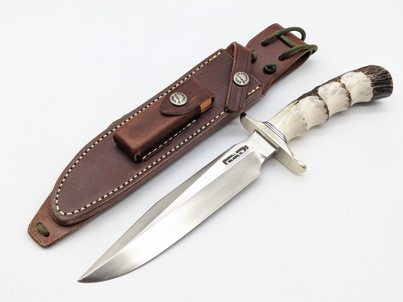 Randall Model 1 7in Stainless Steel Finger Groove Stag All Purpose Fighter w/ Sheath: Knife is in like new condition. Features a stainless steel blade, a nickel silver downturned double guard, and finger groove stag handle with duralumin spacers. Comes with the Randall leather sheath a