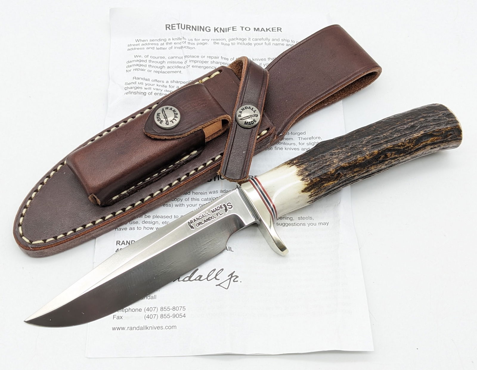 Randall Model 5 Stag Camp & Trail Knife w/ Sheath, Stone, & Papers: Knife is in new condition. Features a stainless steel thumb notched blade, nickel silver single downturned guard, and stag handle. Comes with the Randall leather sheath, the sharpening stone, papers,
