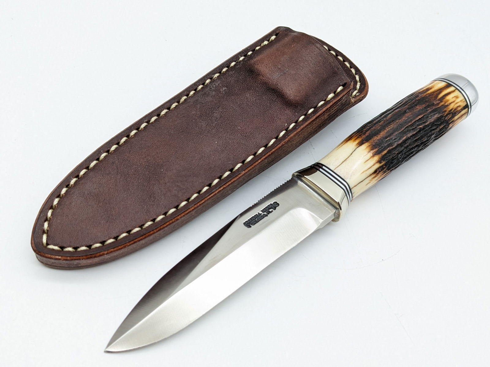 Randall Stainless Steel Stag Handle 4in Gambler w/ Sheath: Knife is in like new condition. Features a stainless steel blade with thumb notches, nickel silver reduced guard, stag handle, and duralumin butt cap. Comes with the Randall leather sheath. Blade leng