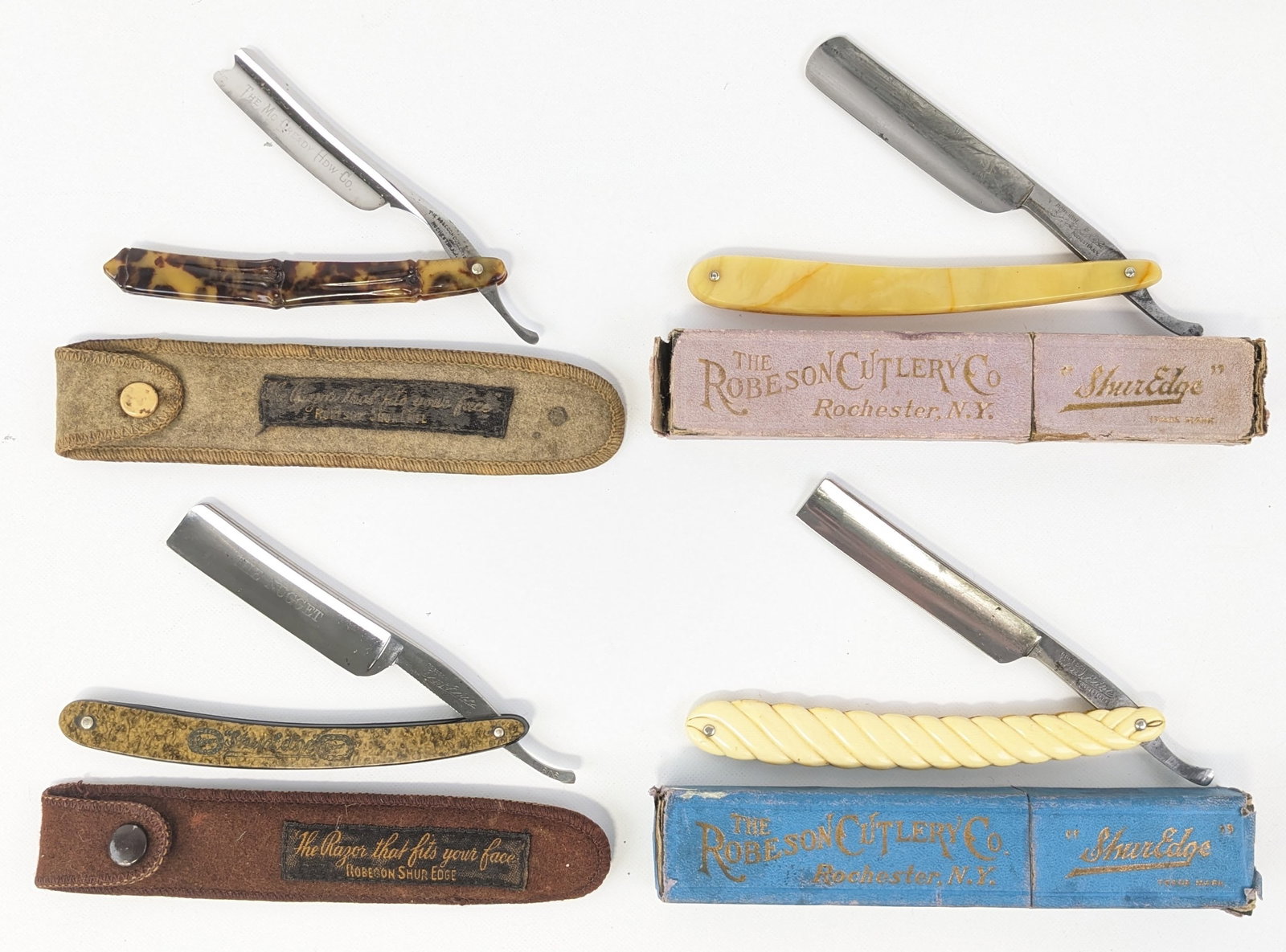 (4) Robeson Cutlery Co. Straight Razors w/ Boxes & Sleeves: Razor models include The Nugget 1506, 1579, 3580, and a McCready HDW Co. marked blade. Knives feature unique celluloid and plastic handles, and are in nice aged condition with carbon spots and scuffs