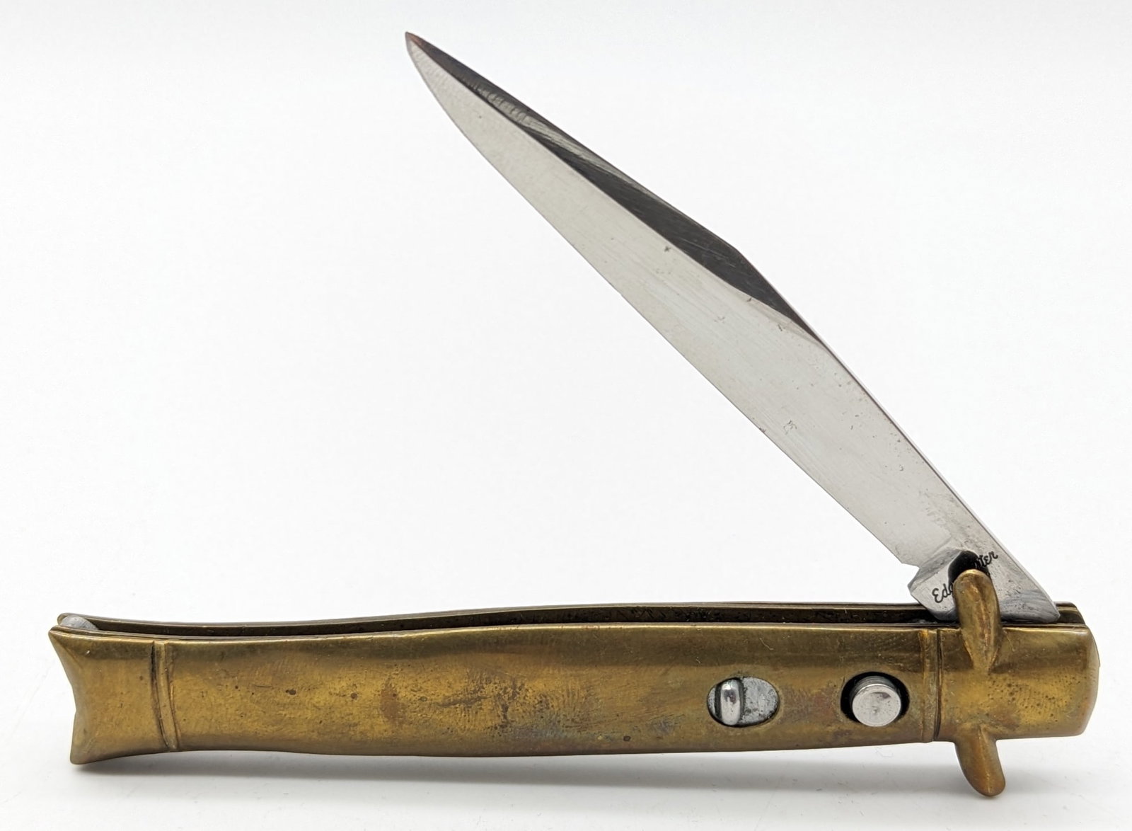 Edgemaster Brass Fishtail Bowtie Switchblade Knife: Knife is in good condition with some scuffs on the blade, and tarnishing on the brass handle and bolsters. Knife spring is strong, and has very little play when locked open. Overall measures 4in when 
