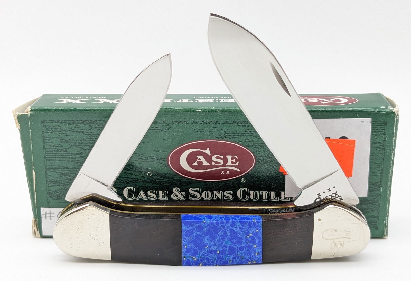 2001 Case XX Custom Ebony & Lapis Canoe Knife 62131: Knife is numbered 001 and is in very nice condition with light wear from handling. The box does not match the knife. Overall measures 3-5/8in when closed.
