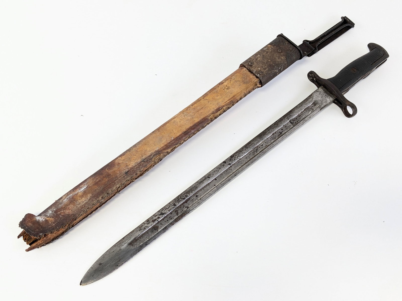 WWI RIA US M1905 Bayonet w/ Scabbard: Features a fullered blade dated 1906 stamped US with the flaming bomb, steel guard missing the locking latch, wood handle, and steel pommel. The scabbard is well worn with none of the leather remainin