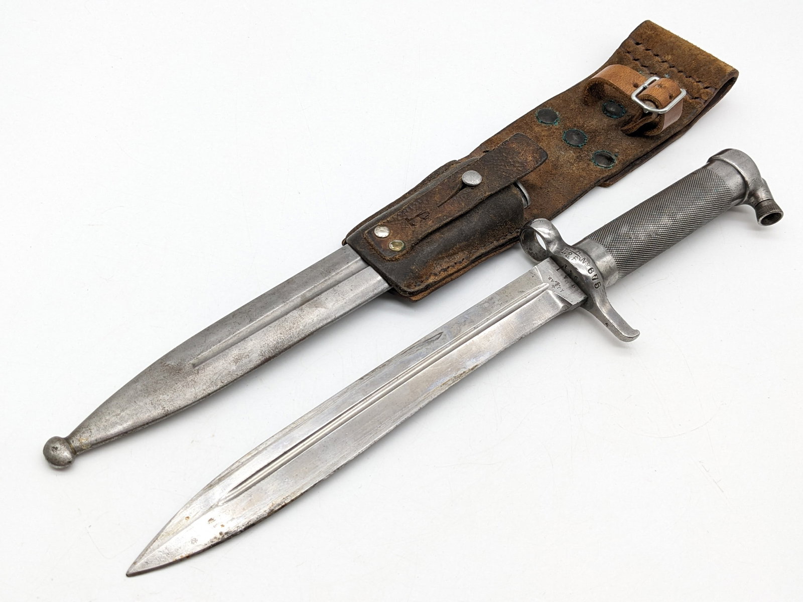 Swedish M1896 Mauser Bayonet w/ Scabbard & Frog: Bayonet is stamped on the blade with various inspection marks, and the guard has regimental markings. The bayonet is in very nice condition with light wear from use and age. The scabbard has scattered