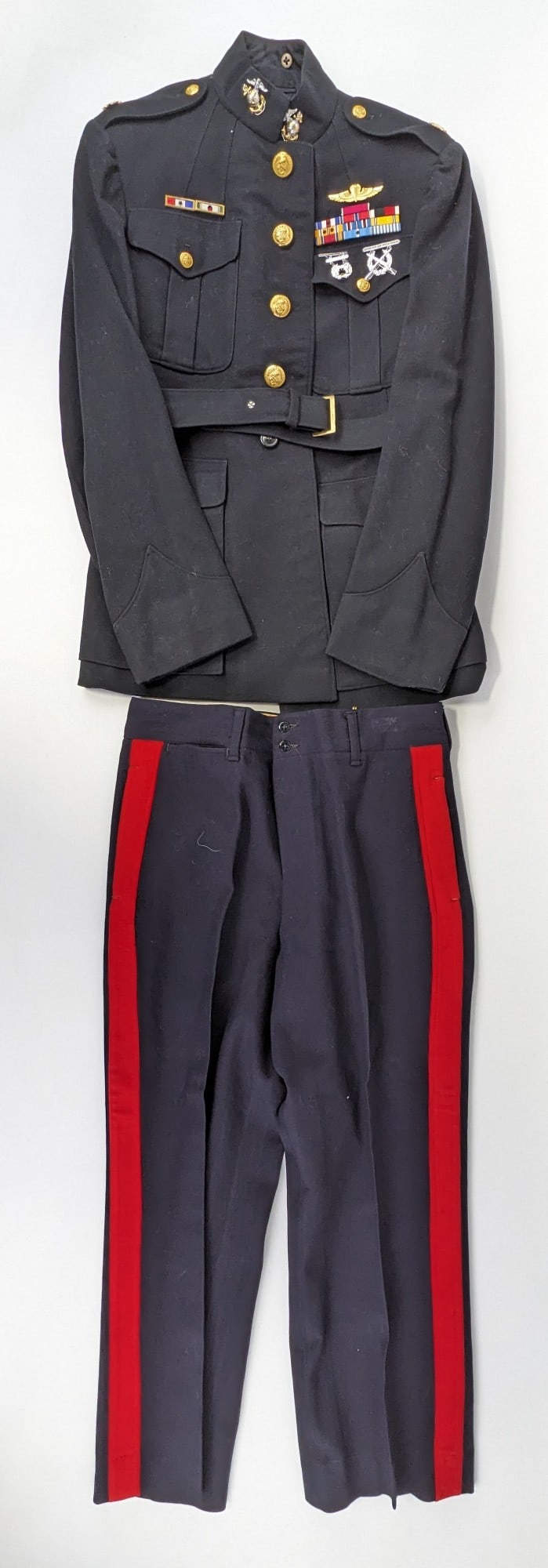 Named WWII Era USMC Major Dress Uniform: Uniform jacket is named to Capt. W. Oberhoff, and the pants are named to H. Bean. Jacket is marked with the US Major gold oak leaves, WWII victory ribbon, Korean war ribbon, and various other ribbons 