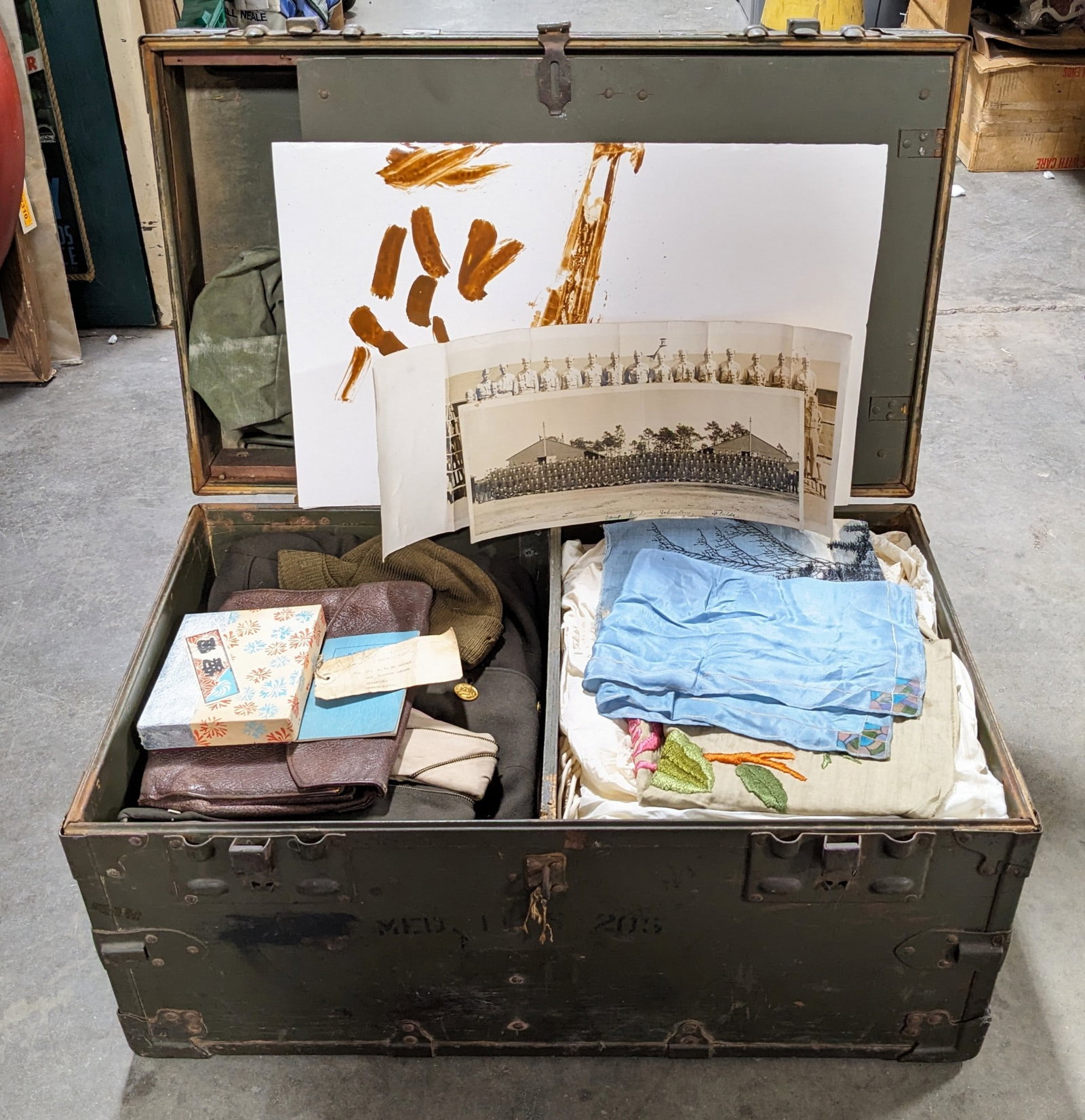 Named WWII US Army Personal Footlocker: Locker is named to Lieutenant Suzanne R. McNerney who appears to of been a nurse in the Pacific based on the contents of the trunk. Includes various color US uniforms with side caps with one having a 