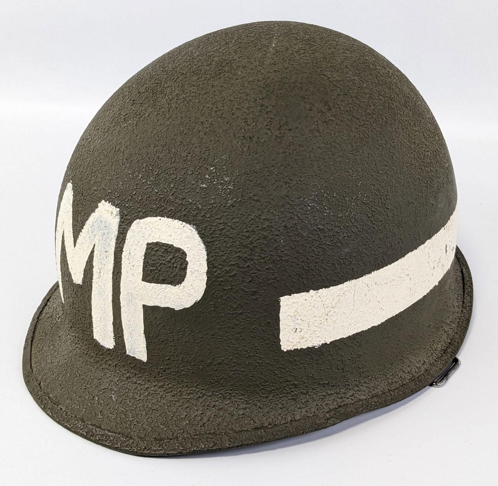 Vietnam Era US Army MP M1 Helmet: Helmet features a rough green paint with white painted band and MP on the front, and green plastic liner with canvas webbing. Helmet is in very nice condition with light wear from use and age.
