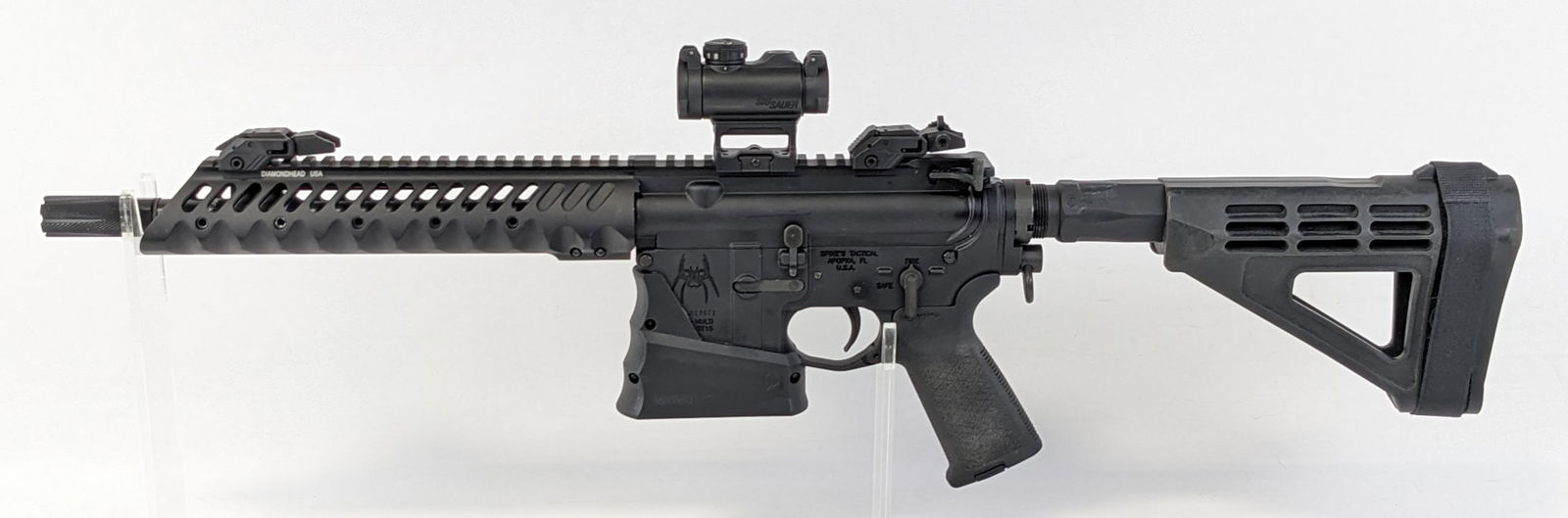 Spike's Tactical ST-15 5.56mm Semi Auto Pistol: Manufacturer: Spike's Tactical.Model: ST-15.Type: Pistol. Caliber/Gauge: 5.56mm. Barrel: 10-1/2 inch. Choke: . Finish: Black. Grip: . Stock: Composite. Condition: Nice with light scuffs and wear from