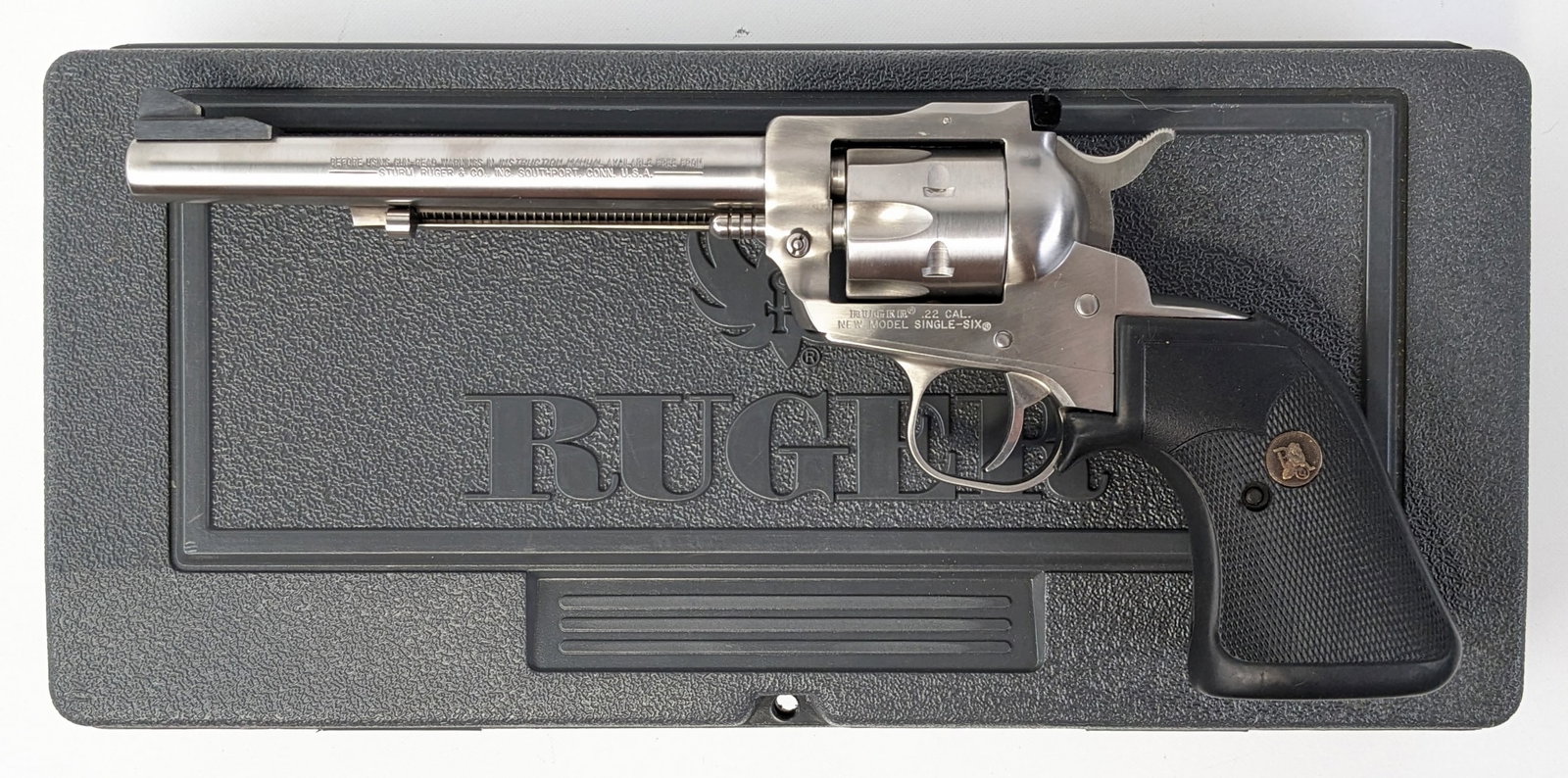 Ruger New Model Single-Six .22 Cal Revolver w/ Case: Manufacturer: Ruger.Model: New Model Single-Six.Type: Revolver. Caliber/Gauge: .22 LR / .22 WMR. Barrel: 6-1/2 inch. Choke: . Finish: Stainless Steel. Grip: Rubber. Stock: . Condition: Near new with m