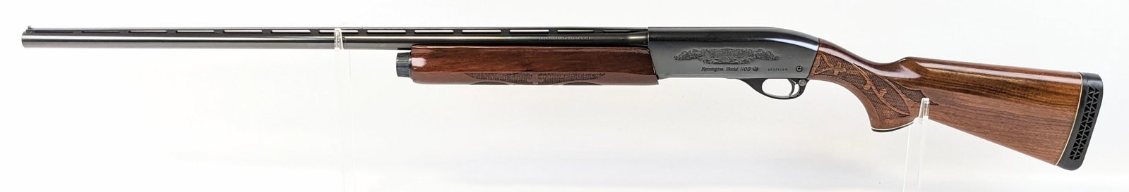 Remington Model 1100 Magnum 12 Ga Semi Auto Shotgun: Manufacturer: Remington.Model: 1100 Magnum.Type: Shotgun. Caliber/Gauge: 12 Ga. Barrel: 30 inch. Choke: Full. Finish: Blued. Grip: . Stock: Checkered Walnut. Condition: Very nice with light wear from 