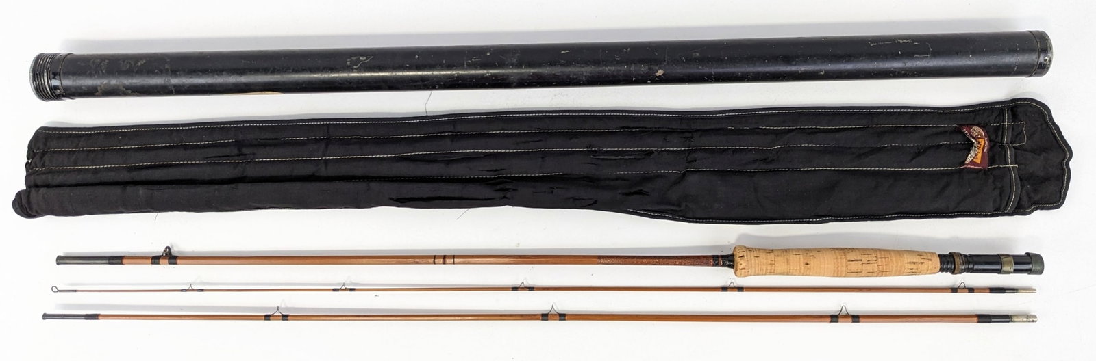 Vtg Heddon Black Beauty Split Bamboo Fly Fishing Rod w/ Tube: Comes in the original black sleeve and tube. Pole comes apart into 3 pieces with a cork handle and measures 8-1/2ft. Pole is in nice condition with some general wear from use and age. The sleeve has a