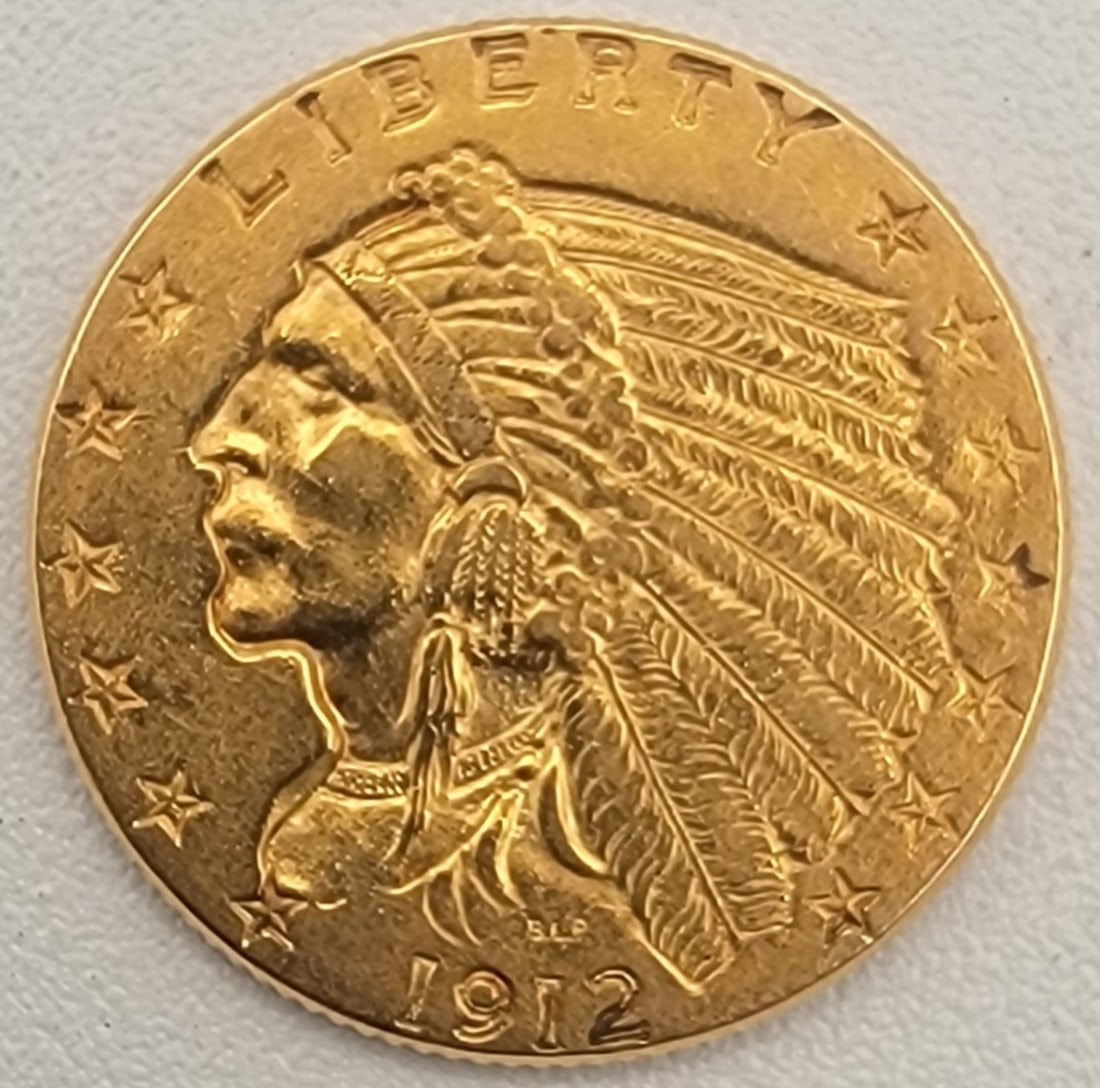 1912 United States $2-1/2 Indian Head Gold Coin: 1912 United States $2 1/2 Indian Head Gold Coin Contains .12094 troy ounce of pure gold. Nice condition coin.
