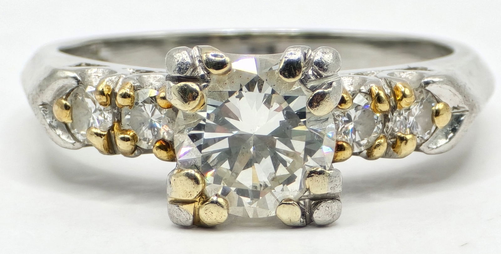 Vintage Ladies Platinum 1 Carat Diamond Engagement Ring: Vintage Ladies Platinum Diamond Engagement Ring. The center diamond is a round brilliant cut and is approximately 1 carat. Ring is size 5-1/4 and the total weight is 5.20 grams.