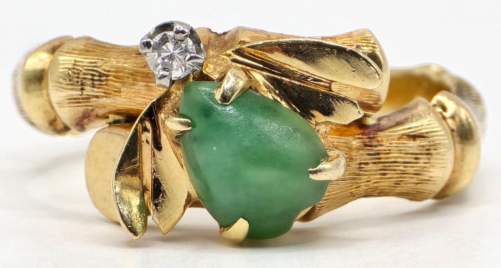Ladies 14K Yellow Gold Jade & Diamond Insect Bamboo Ring: Ladies 14K Yellow Gold Jade & Diamond Insect Bamboo Ring. The ring is in the shape of bamboo featuring a jade body insect with a genuine diamond head. Ring is size 4-3/4 and the total weight is 4.95 g