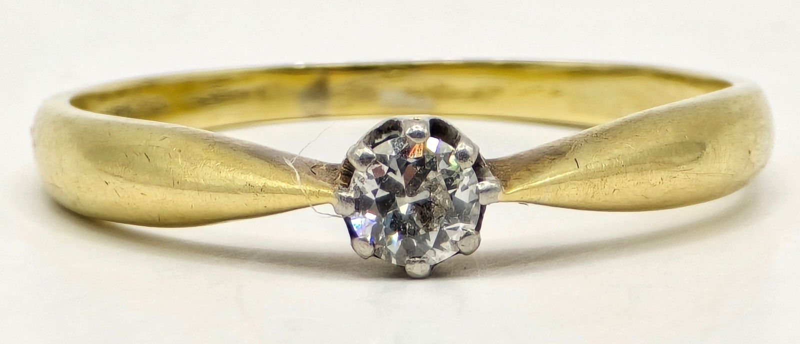 Ladies 14K Yellow Gold Diamond Solitaire Ring: Ladies 14K Yellow Gold Diamond Solitaire Ring. The round genuine diamond is approximately .17 carats. Ring is size 5-3/4 and the total weight is 1.87 grams.