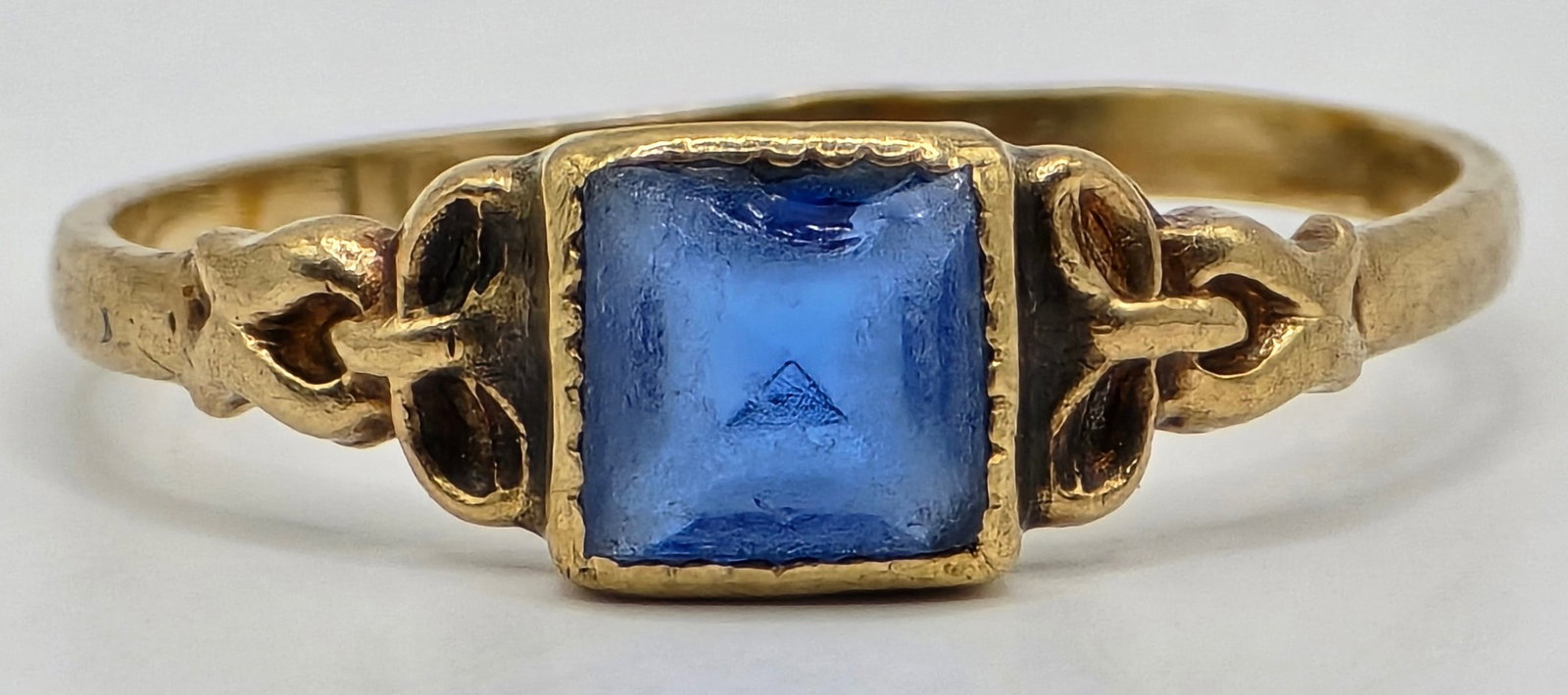 Antique 10K Yellow Gold Child's Ring: Antique 10K Yellow Gold Child's Ring. The ring has a synthetic blue center stone. Ring is size 2-1/4 and the total weight is .61 grams.