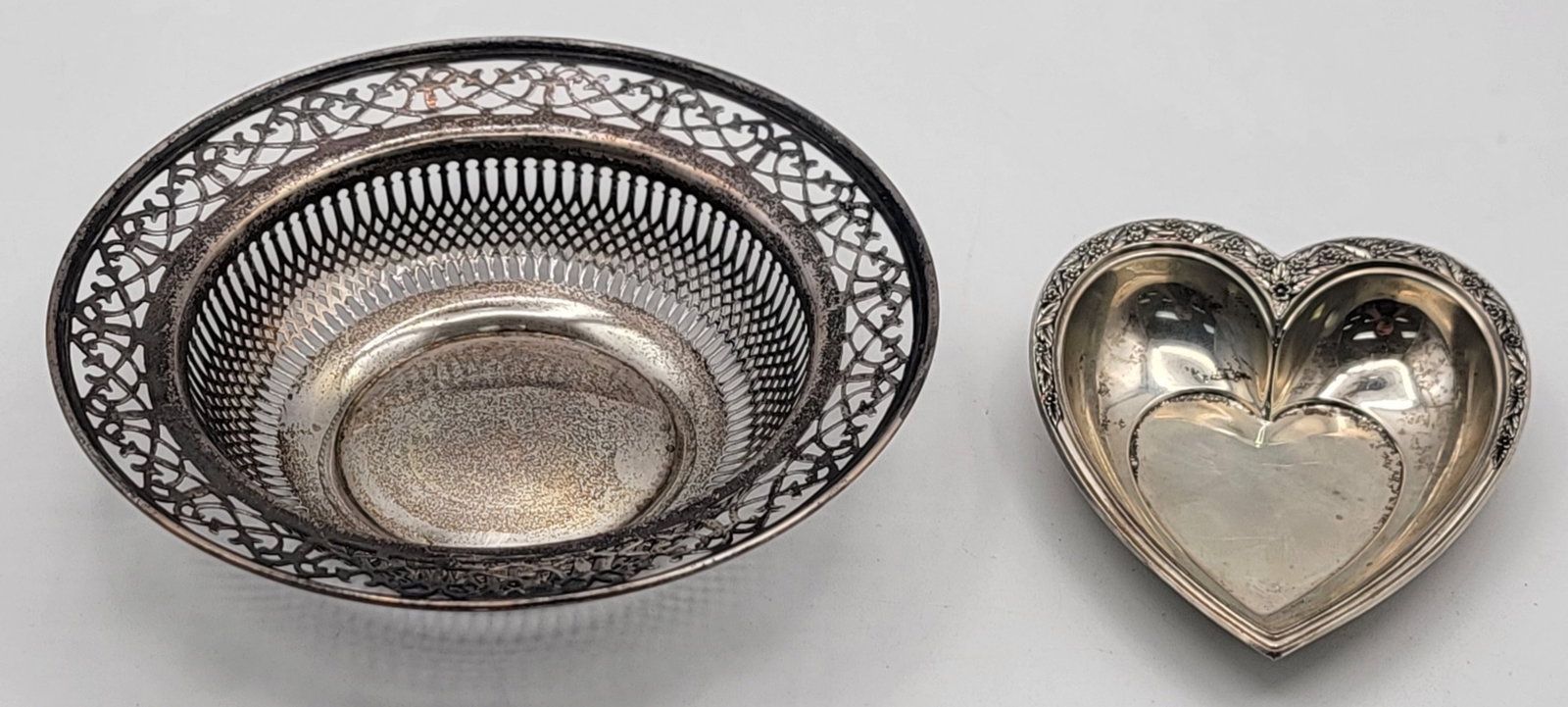 Pair Of Vintage Sterling Silver Bowls: Lot includes a 5-1/2" diameter bowl & an International Silver heart bowl. Total weight approximately 3.30 troy ounce of sterling silver.