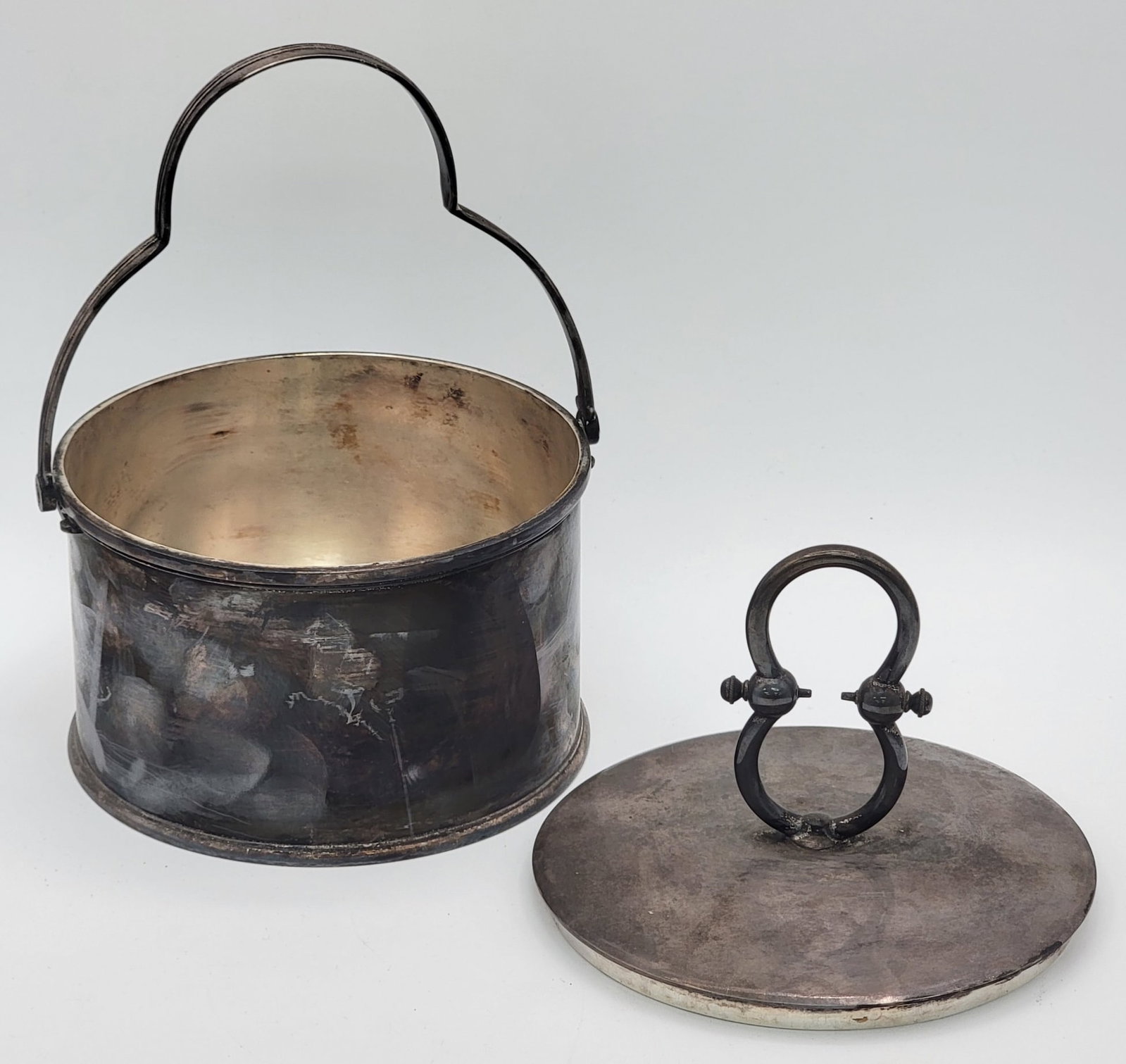 Antique Tiffany & Co. Makers Silver-Soldered Handled Lidded Box: Antique Tiffany & Co. Makers Silver-Soldered Handled Lidded Box. The round box is marked "1008 Tiffany & Co. Silver-Soldered". With the handle up it measures 7-1/4" tall with a 5-1/2" base diameter. N