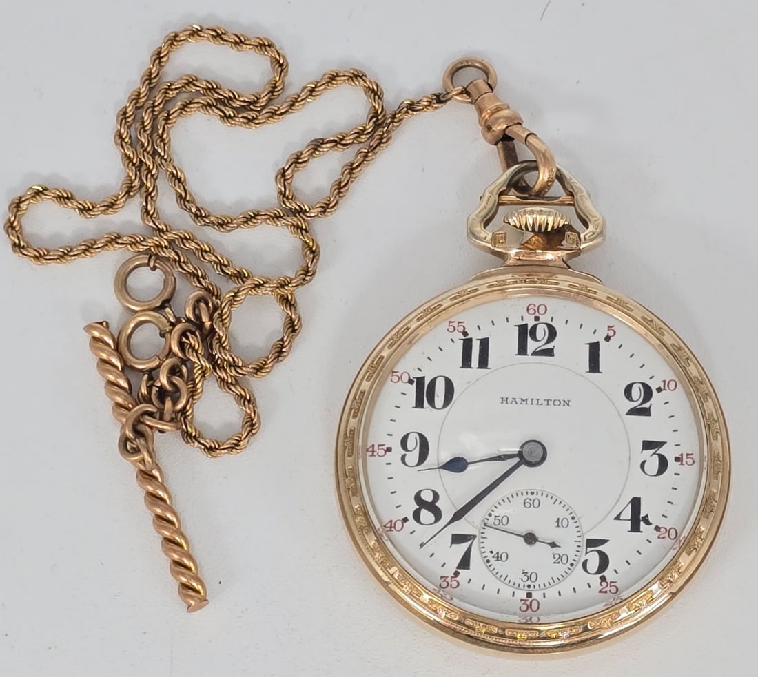 1922 Hamilton 992 Railroad Grade Open Face Pocket Watch: 1922 Hamilton 992 Railroad Grade Open Face Pocket Watch. The 21 jewel size 16 watch is in nice running condition. Comes in a 10k gold filled Wadsworth case with a gold filled watch chain.