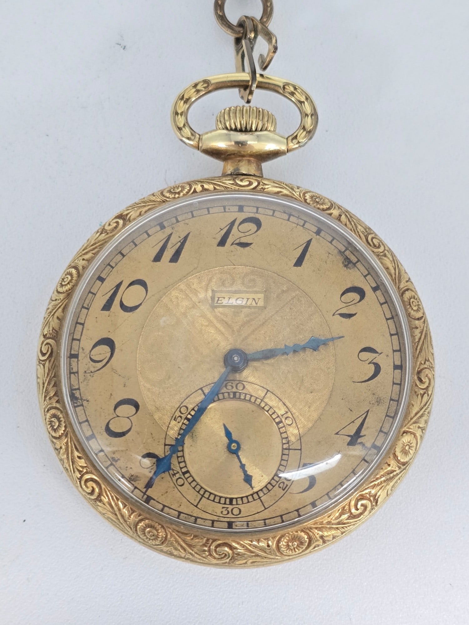 1925 Elgin Grade 303 Open Face Pocket Watch: 1925 Elgin Grade 303 Pocket Watch. The 7 jewel size 12 open face watch is in good running condition. Comes in a Challenge 14k gold filled case, the case back had initials removed. Comes with a gold fi