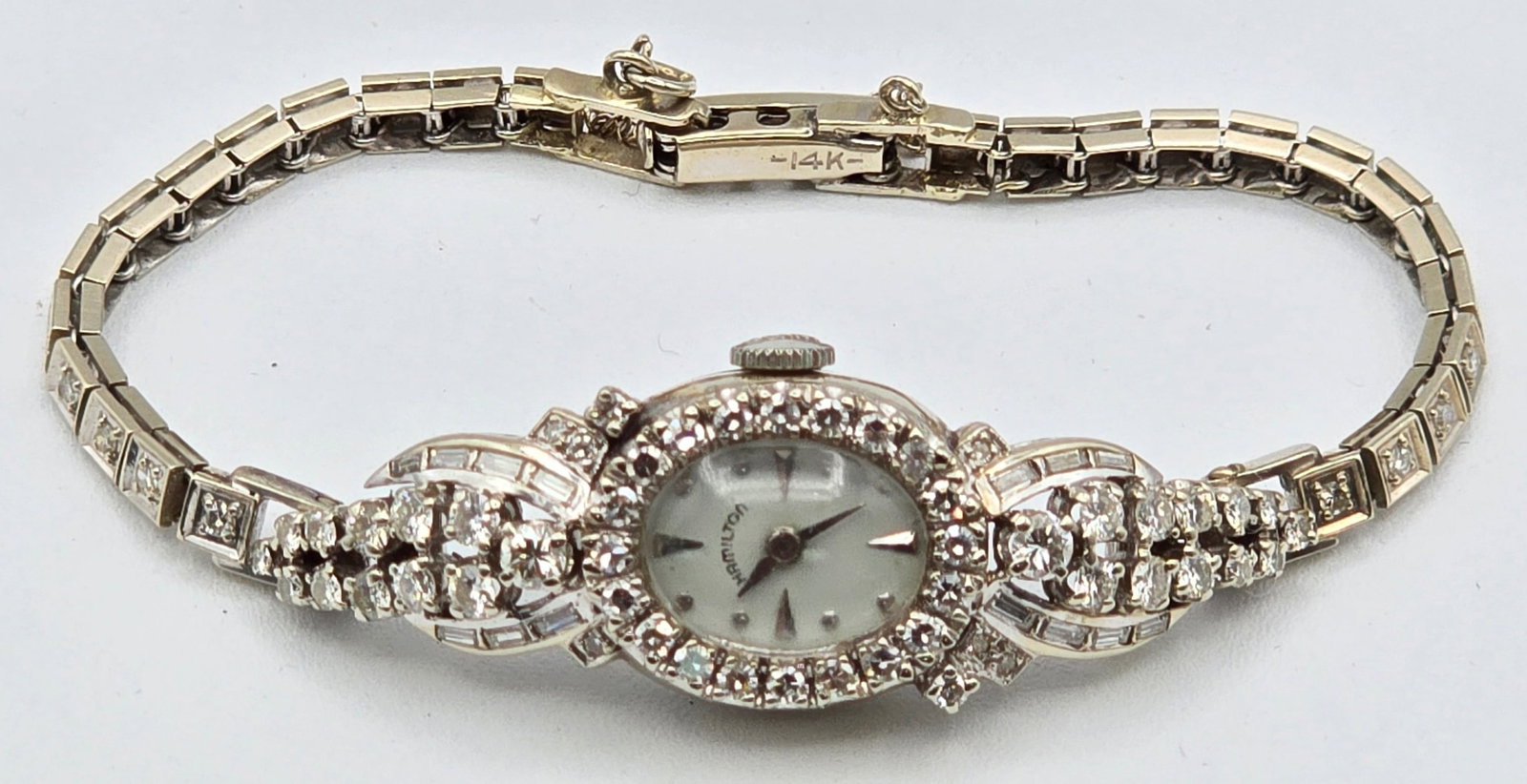 Vintage Ladies Hamilton 14K White Gold Case & Band Diamond Wristwatch: Vintage Ladies Hamilton 14K White Gold Case & Band Diamond Wristwatch. The watch has a 22 jewel #761 mechanical movement and is in nice running condition. The watch includes approximately 74 genuine d