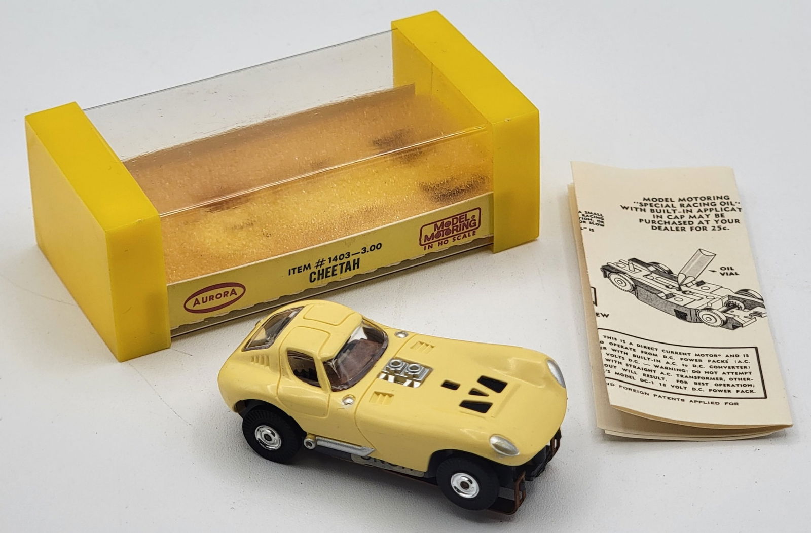 New In Box Aurora T-Jet Yellow Cheetah HO Scale Slot Car #1403: New in box vintage Aurora Model Motoring Thunder Jet "Cheetah" HO scale slot car in yellow. The car is item # 1403 and is in like new never used condition in the original box with instructions.
