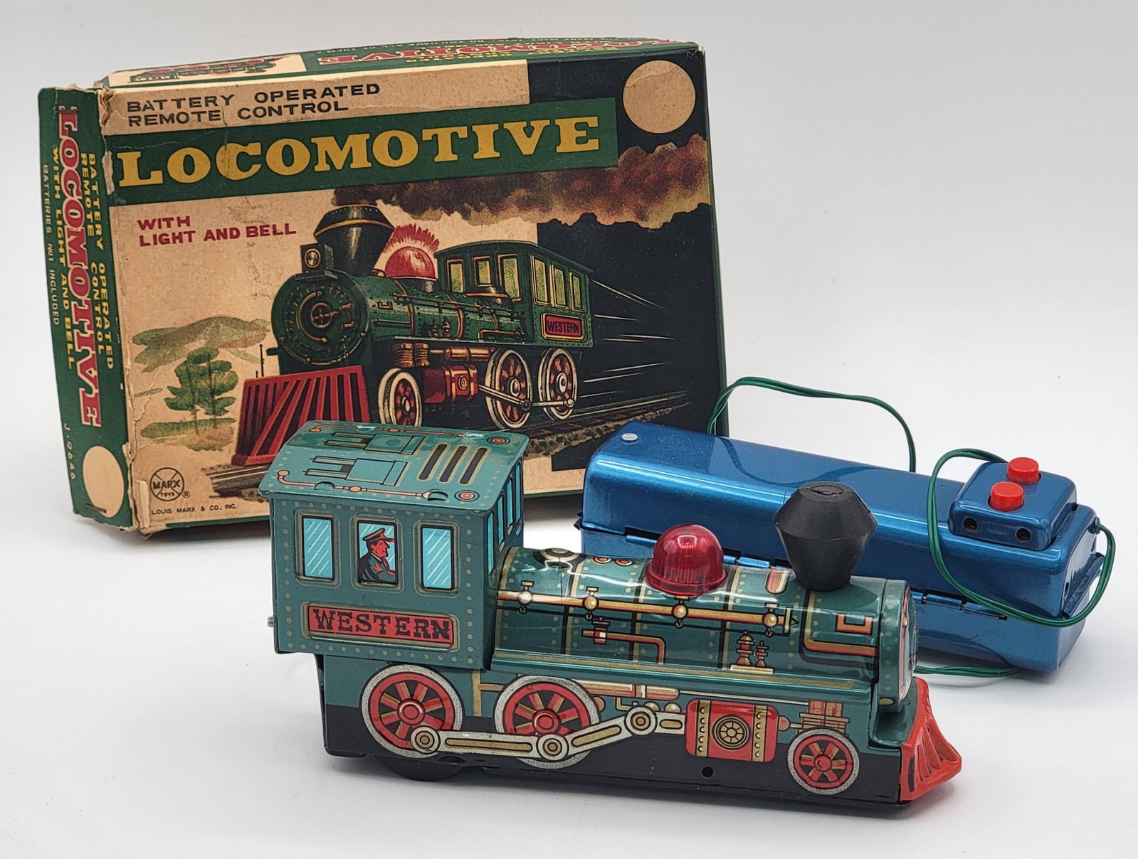 Vintage Marx Tin Litho Battery Operated Remote Control Western Locomotive NIB: New in the original box vintage Marx tin litho battery operated remote control Western Locomotive #J-9646. The toy lights and has a bell. The locomotive is in like new condition, the box shows some sh