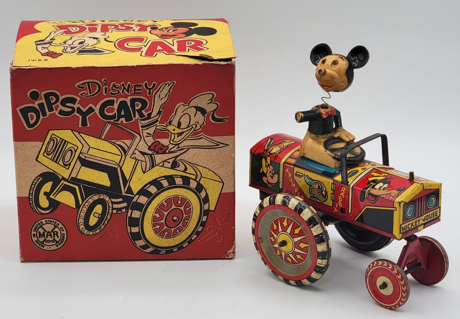 Vintage Marx Tin Litho Wind-Up Disney Dipsy Car In Box: Vintage Marx Tin Litho Wind-Up Disney Dipsy Car In Box. The car is in good played with condition, Mickey Mouse is missing one hand and the wind-up mechanism works, but is weak. The box is complete wit