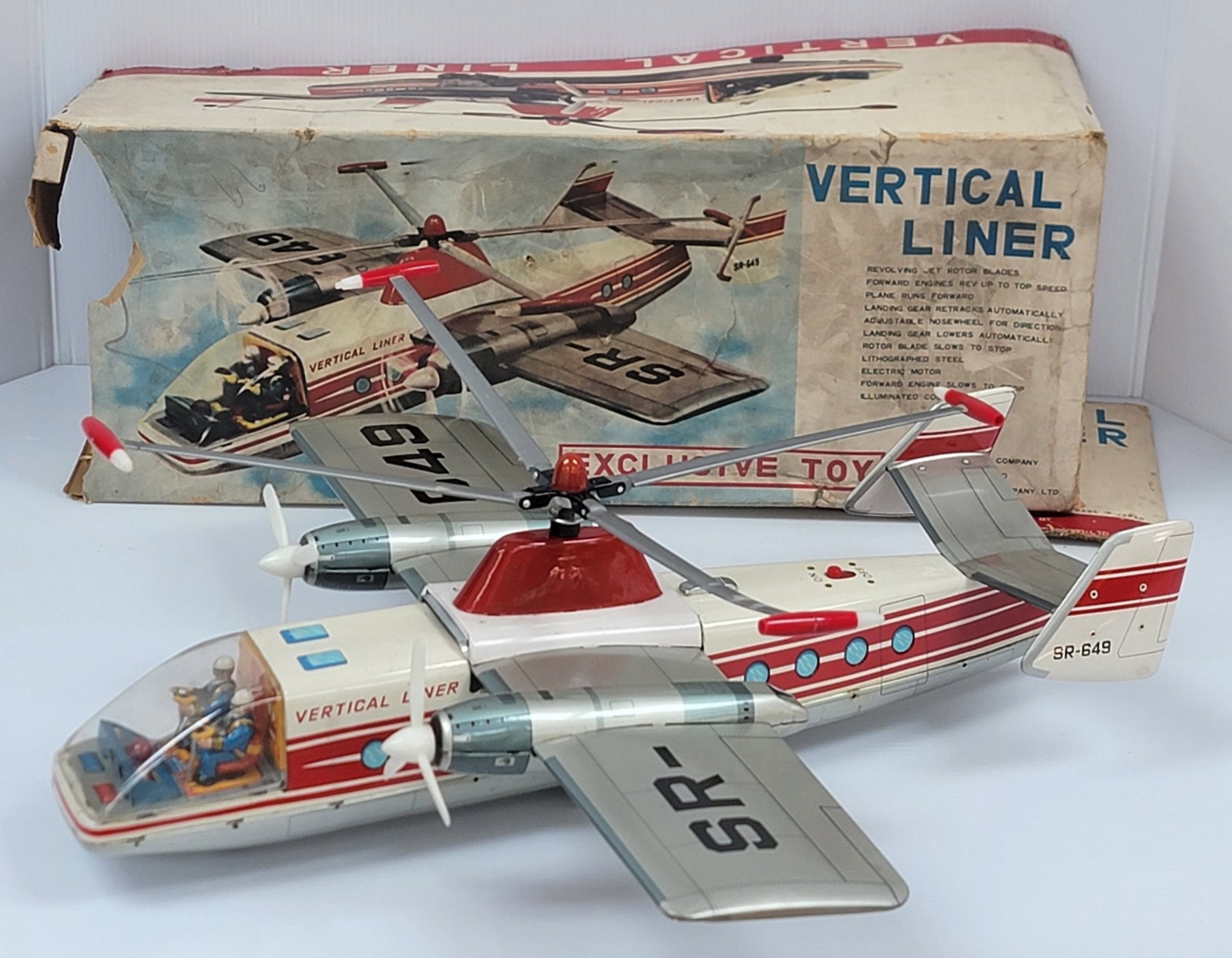 Vintage Sears Roebuck Japan Tin Litho Battery Operated Vertical Liner Plane In Box: Vintage Sears Roebuck Japan Tin Litho Battery Operated Vertical Liner Plane In Box. The plane is in very nice condition with only very light storage and play wear. Measures 18" across x 6" tall with a