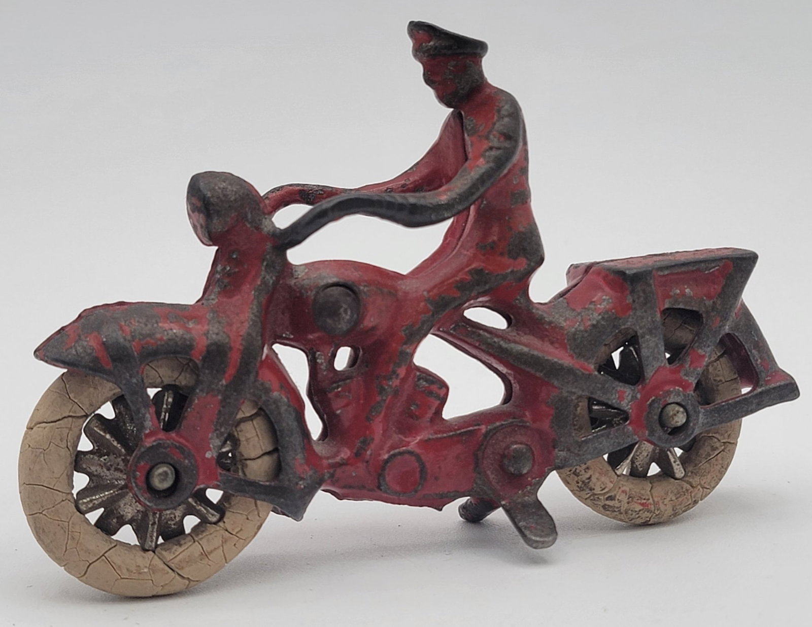 Vintage Kilgore Cast Iron Motorcycle With Delivery Rack: Vintage Kilgore Cast Iron Motorcycle With Delivery Rack. Comes with nickel wheels and is all original. Has some paint loss and play wear, but is very nice. Measures 4" across.