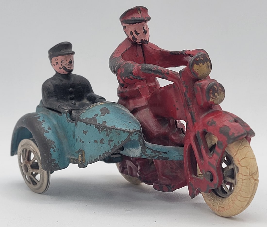 Antique Hubley Harley-Davidson Motorcycle With Sidecar and Riders: Antique Hubley Harley-Davidson Motorcycle with Sidecar and Riders. Comes with nickel wheels and is all original. Has some paint loss and play wear, tires are cracked and one is missing on the sidecar.