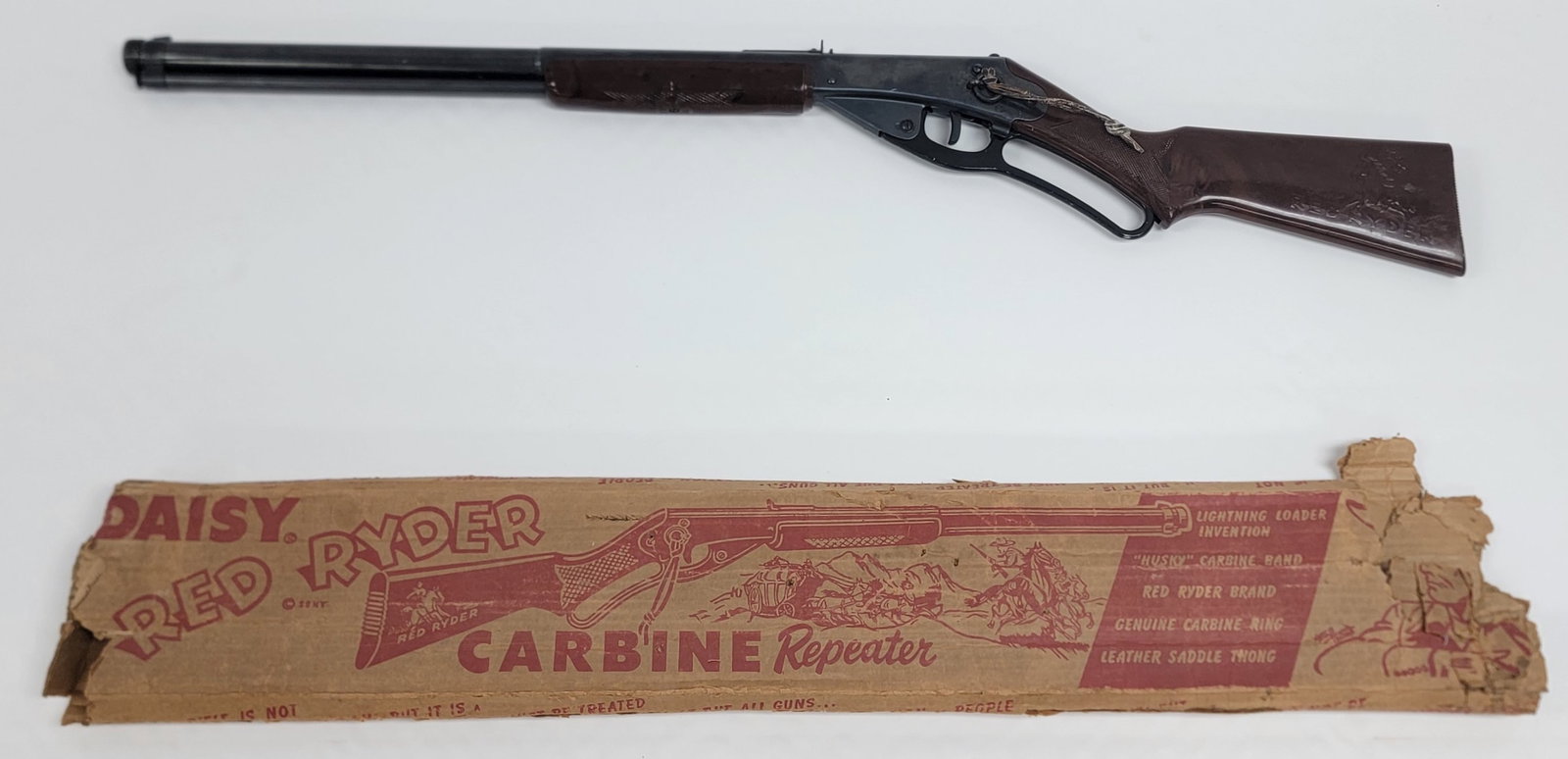 Vintage Daisy Red Rider Carbine No 111 Model 40 BB Rifle Plymouth Michigan: Vintage Daisy Red Rider Carbine No 111 Model 40 BB Rifle made in Plymouth Michigan. The carbine is in nice working vintage condition with the original box, box is in poor condition. Overall measures 3