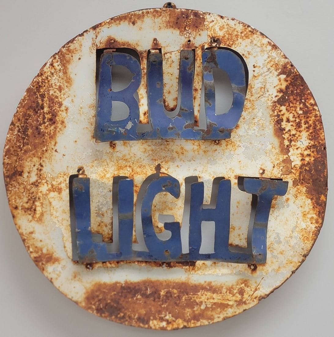 Distressed Metal Bud Light Cap Cookie Cutter Advertising Sign: Distressed Metal Bud Light Cap Cookie Cutter Advertising Sign. The painted sign measures 19-3/4" in diameter.