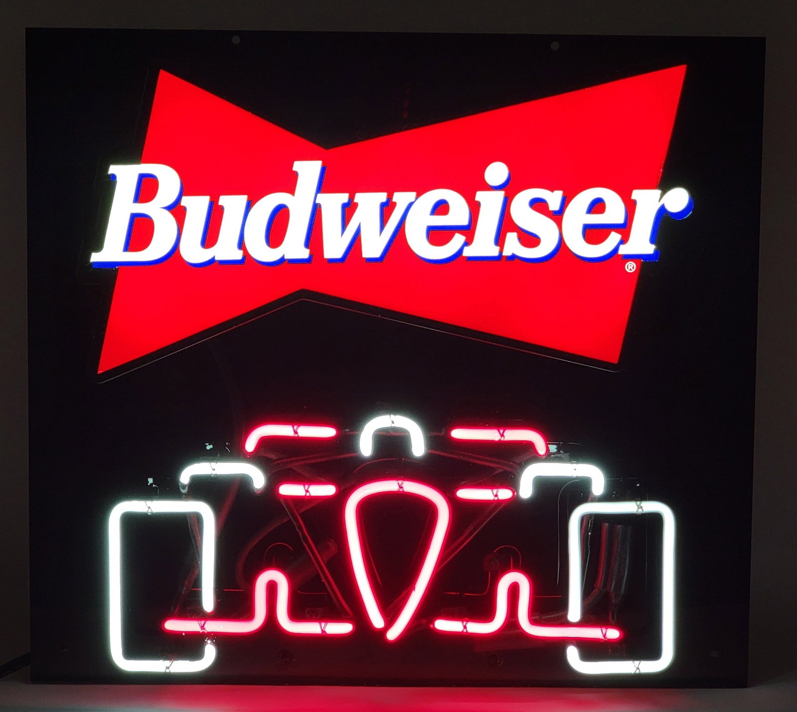 Budweiser Bow Tie Indy Car Two-Color Neon Sign: Budweiser Bow-Tie Two-Color Neon Sign. The neon is mounted on a black acrylic background, works great. Background measures 21" across x 19" tall.