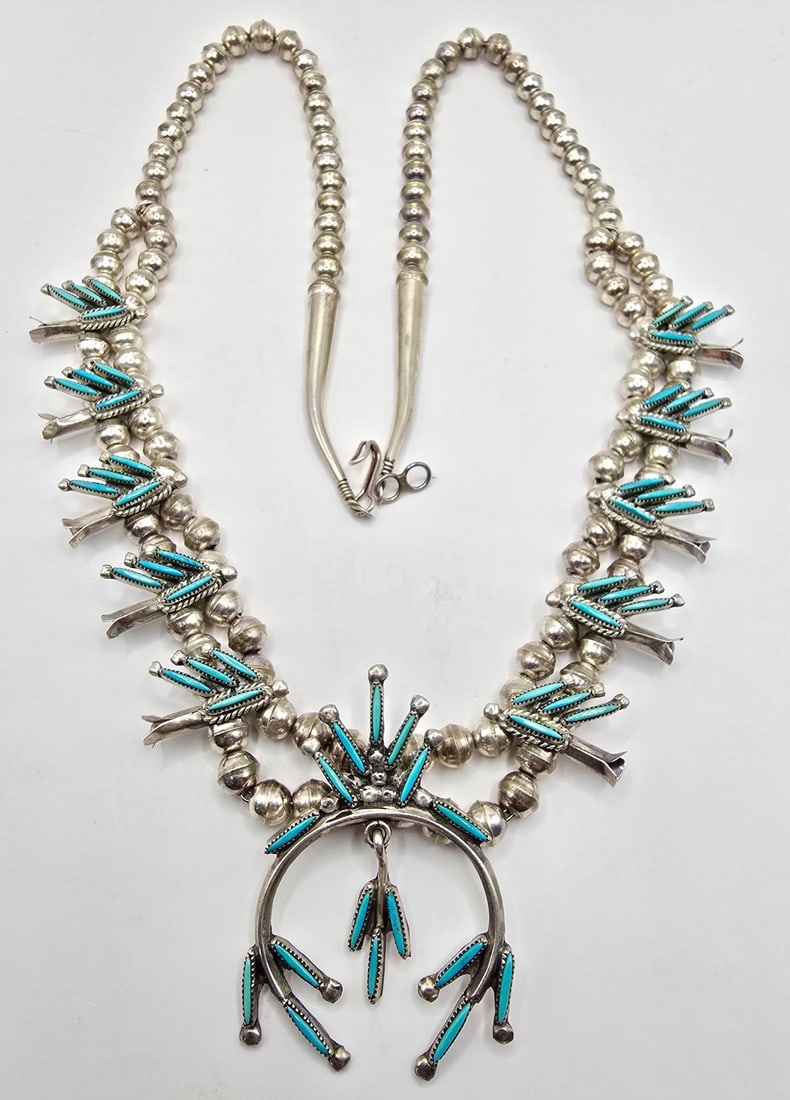 Vintage Native American Sterling Silver Zuni Needlepoint Turquoise Necklace: Vintage Native American Sterling Silver Zuni Needlepoint Turquoise Necklace. The necklace 56 stones and measures 24" long. Total weight is approximately 48.68 grams.