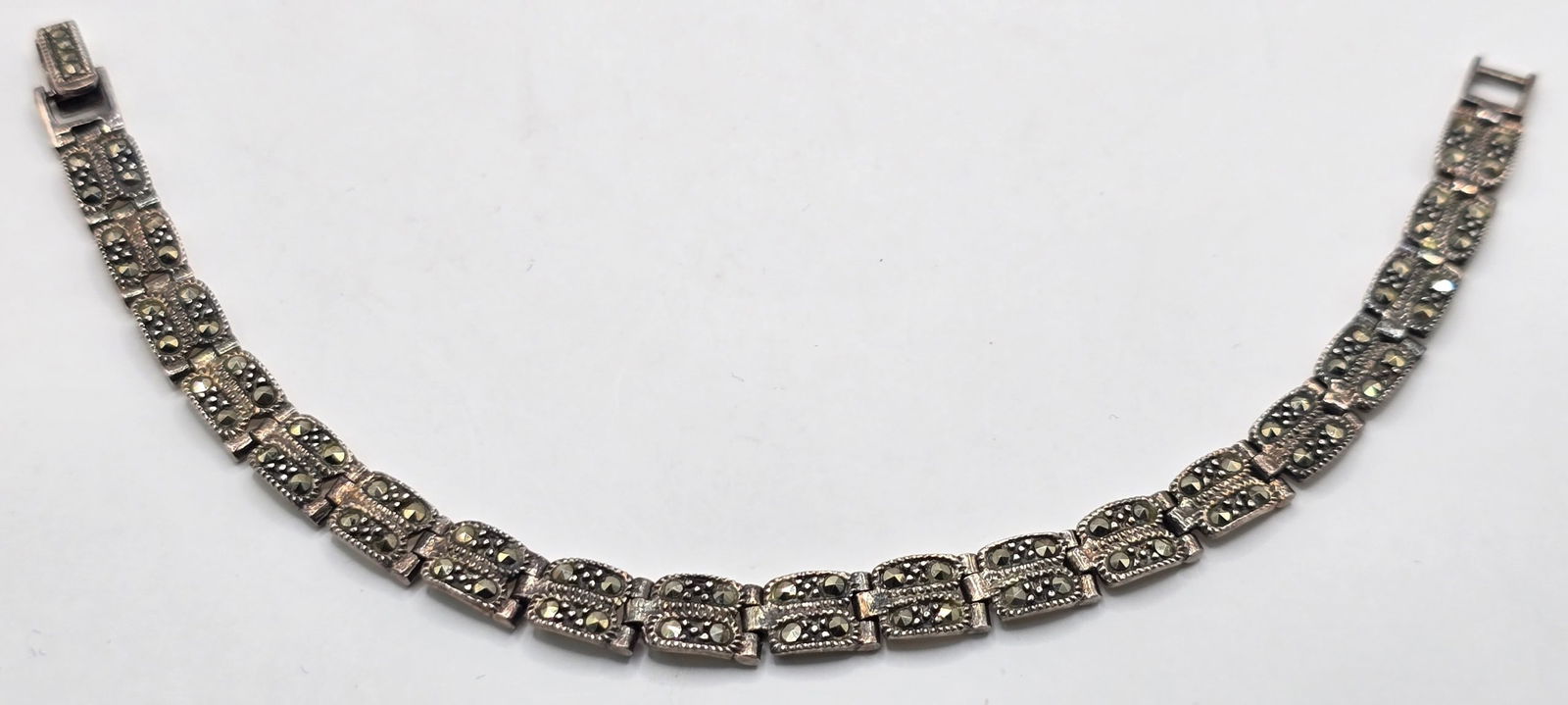 Ladies Sterling Silver Marcasite Bracelet: Ladies Sterling Silver Marcasite Bracelet. The bracelet measures 7" long and the total weight is 12.61 grams.