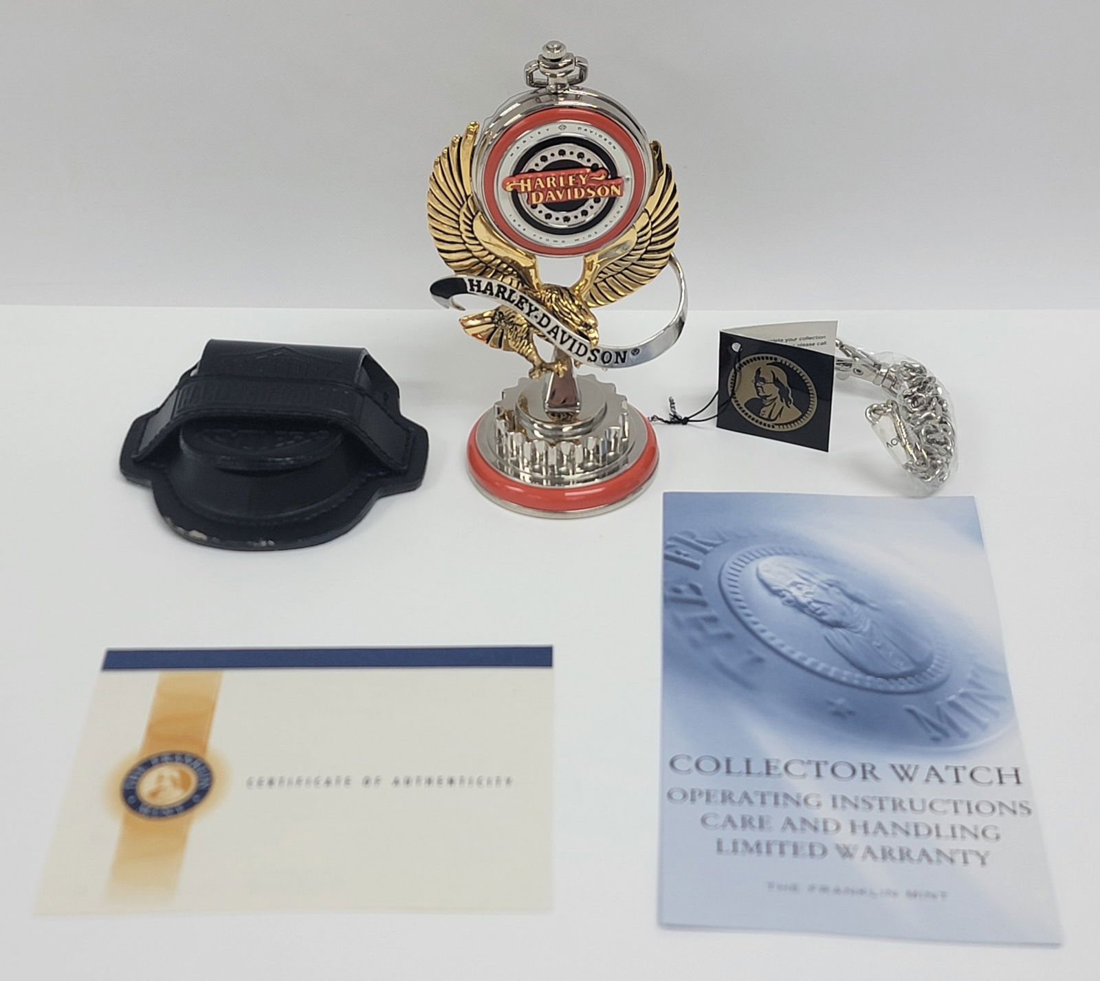 New in box Franklin Mint Harley-Davidson 1998 FXDWG Dyna Wide Glide Pocket Watch: New in box Franklin Mint Harley-Davidson 1998 FXDWG Dyna Wide Glide Pocket Watch. The watch comes with a leather case, watch chain, eagle watch holder, and is in unused new condition in the original b