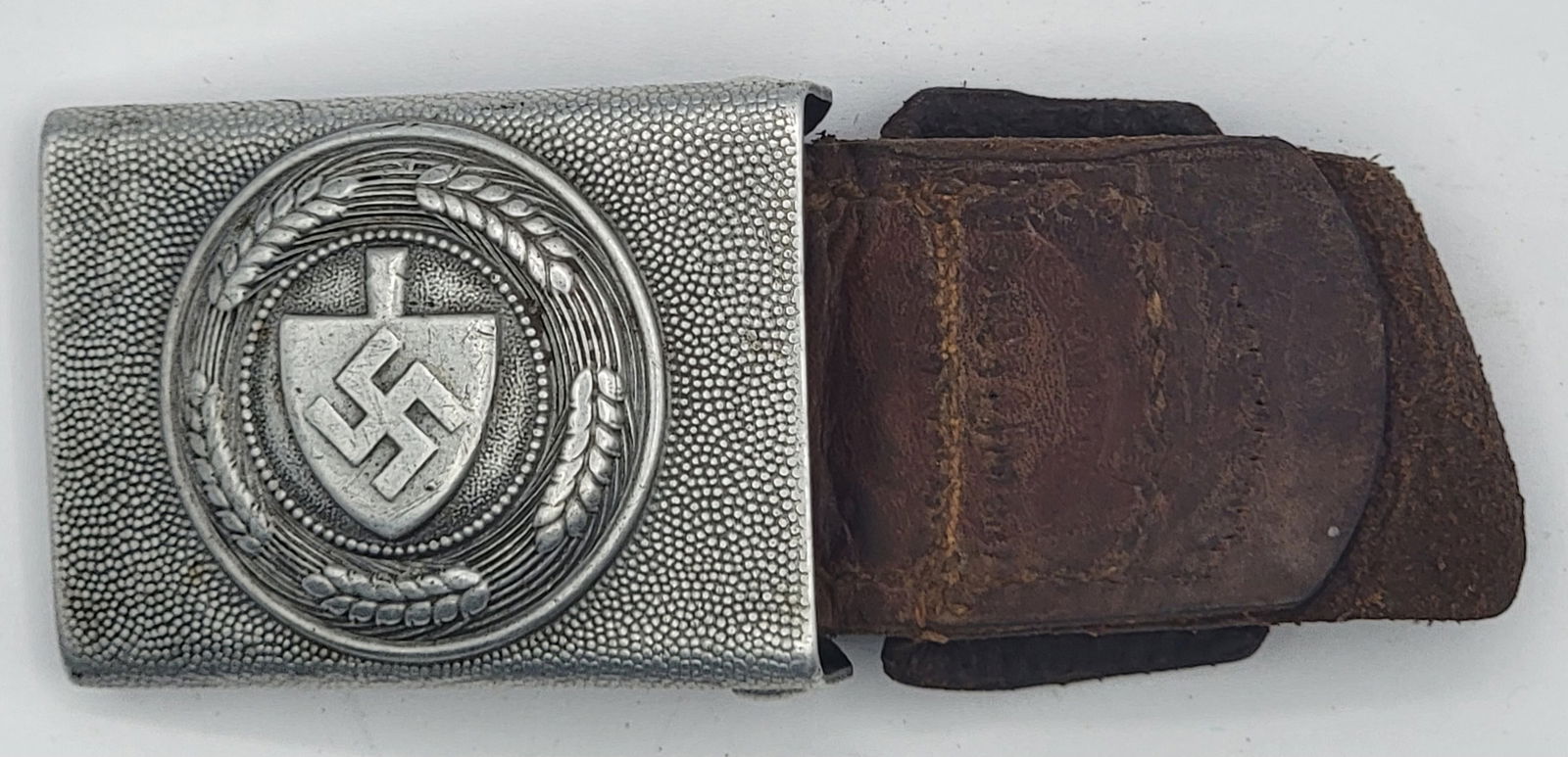 1936 WWII Germany RAD Aluminum Belt Buckle With Leather Tongue: 1936 WWII German Reich Labor Service Aluminum Belt Buckle with leather tongue. The buckle is maker marked and was made in the Gustav Brehmer factory in 1936. It is in nice condition with great detail.