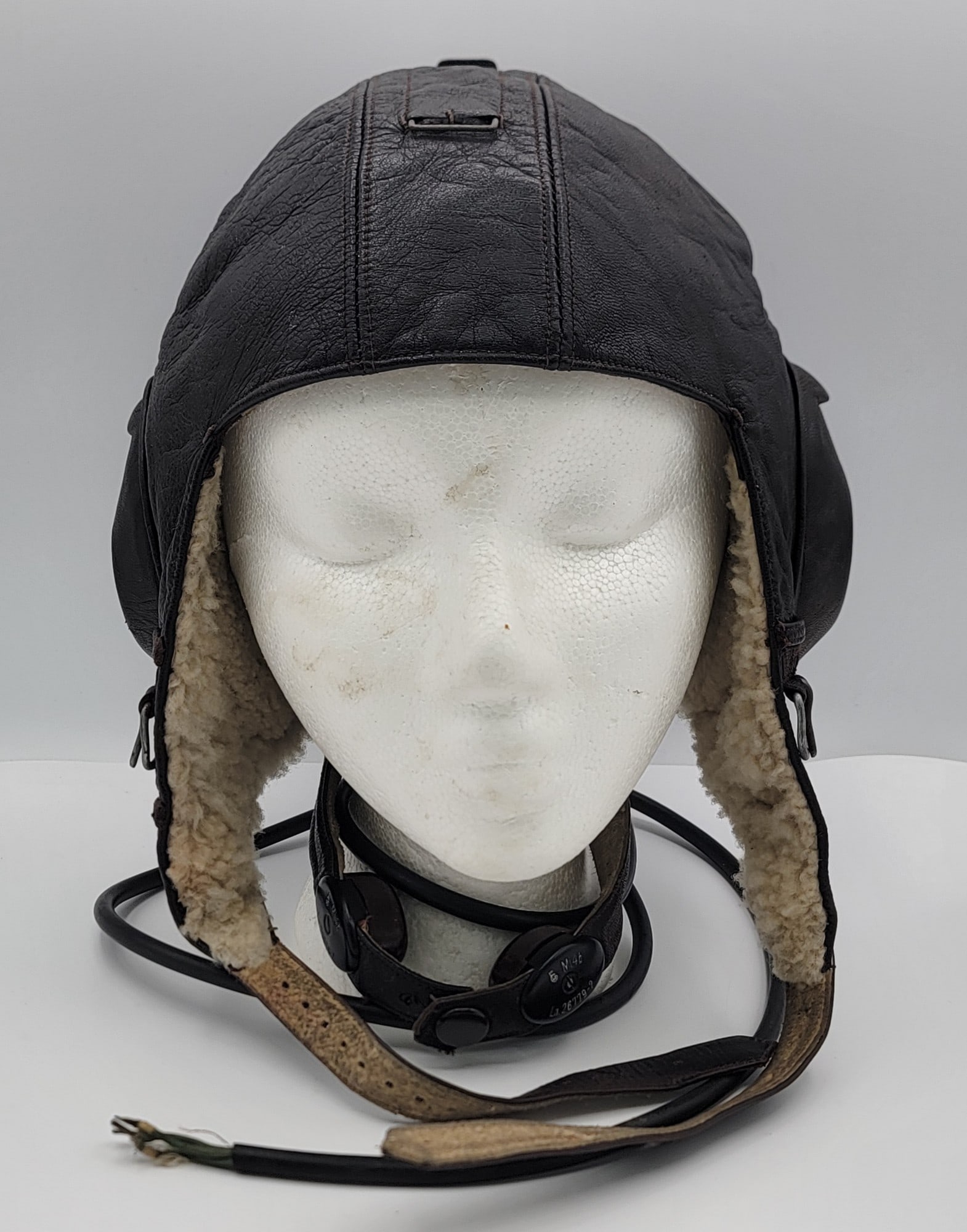 WWII German Luftwaffe LKpW101 Winter Flight Helmet With Communication Equipment: WWII German Luftwaffe LKpW101 Winter Flight Helmet With Communication Equipment. The leather helmet was designed with radio equipment for bomber and fighter pilots. The helmet is made of leather and f
