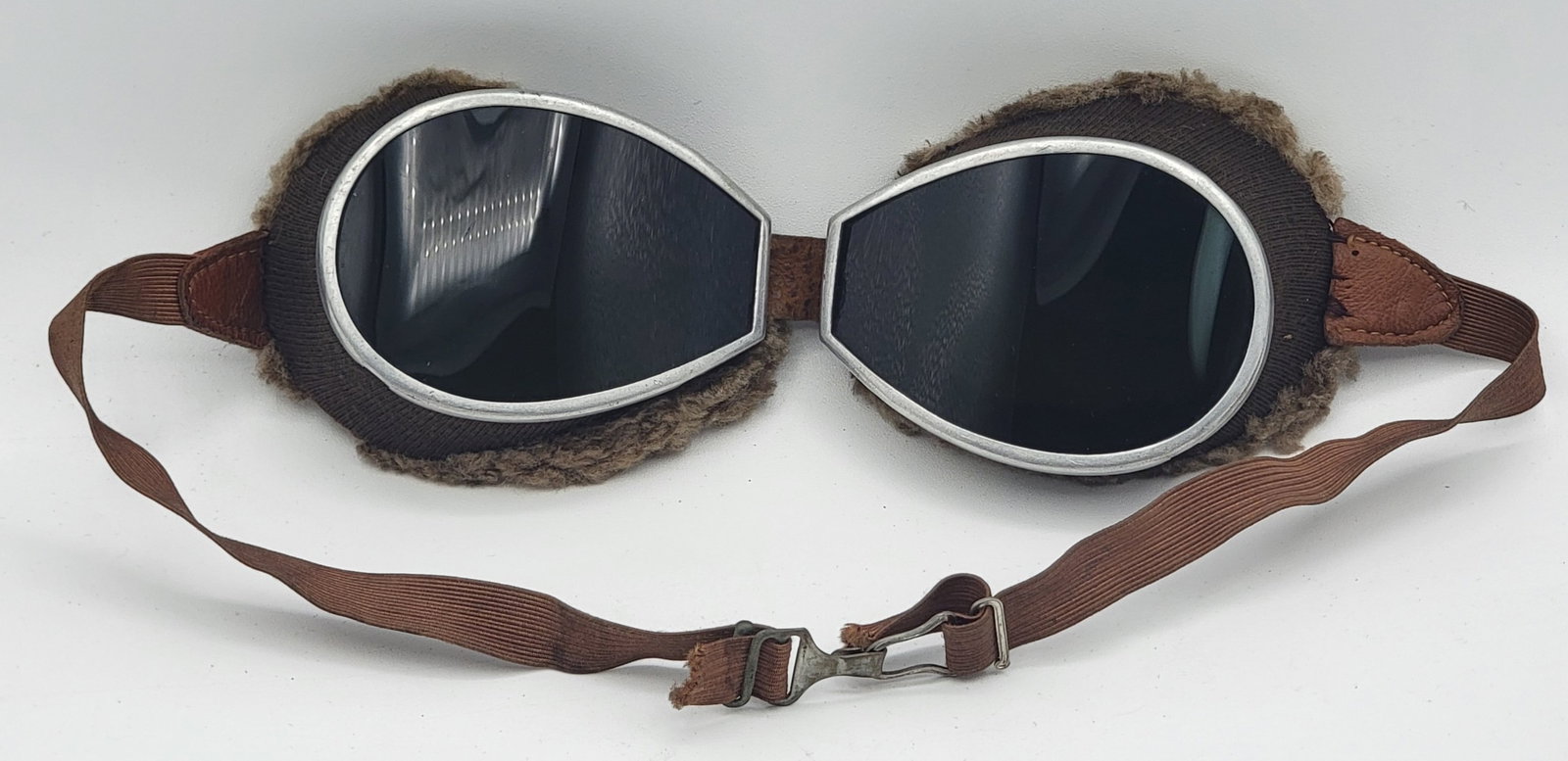 WWII German Luftwaffe Winter Pilot's Goggles: WWII German Luftwaffe Winter Pilot's Goggles. The googles have a dark tint and have interior fleece around the inner frame. The condition is great with clear lenses and the head strap is intact.