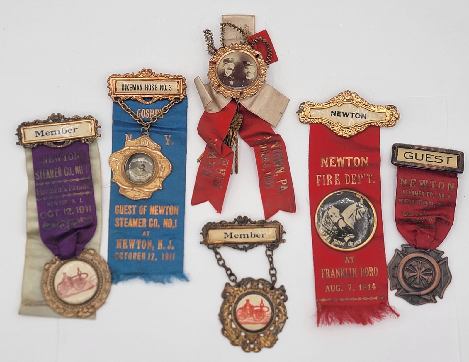 Group Of Six Early 1900's Fire Department Parade Ribbons & Badges: Group Of Six Early 1900's Fire Department Parade Ribbons & Badges. The items appear to be all from the Newton Steamer Co. No. 1 from Newton New Jersey. The group is in nice original condition with pho