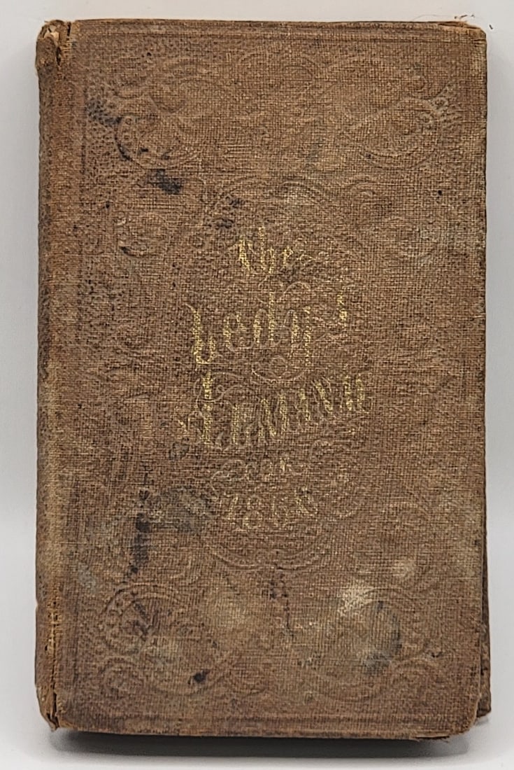 Lady's Almanac For 1866 Hard Cover Book: Lady's Almanac For 1866 Hard Cover Book. The book has 128 general pages plus an advertising section. Good complete condition with some looseness to the binding. Measures 4-1/2" tall x 2-7/8" across.