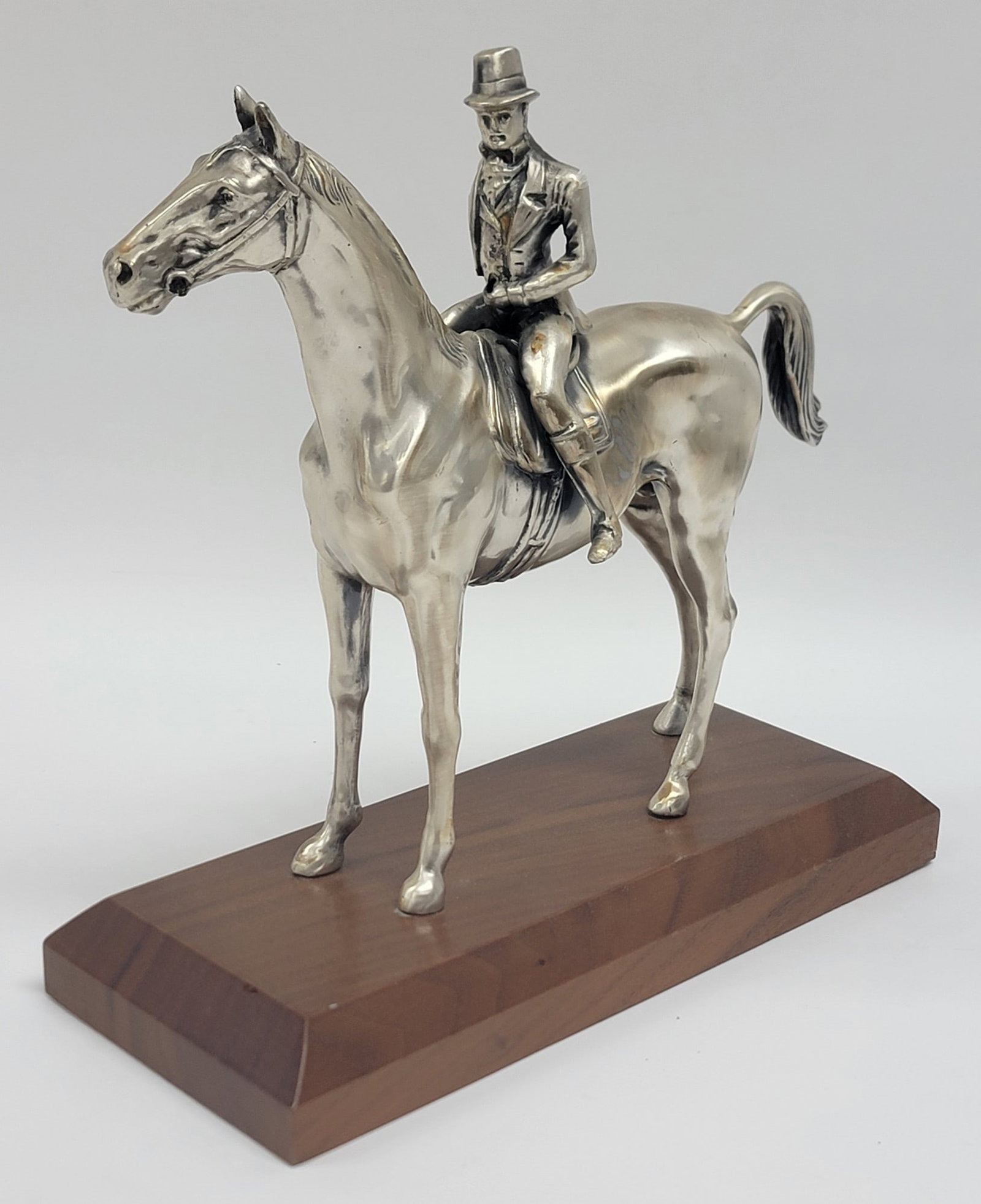 Vintage Weidlich Bros. U.S.A. Silver Plated Fox Hunt Rider On Horse Figure: Vintage Weidlich Bros. Silver Plated Fox Hunt Rider On Horse Figure #2288. The figure has great detail and was designed by A.F. Lauder. It comes mounted on a wooden base and is in nice condition. Over