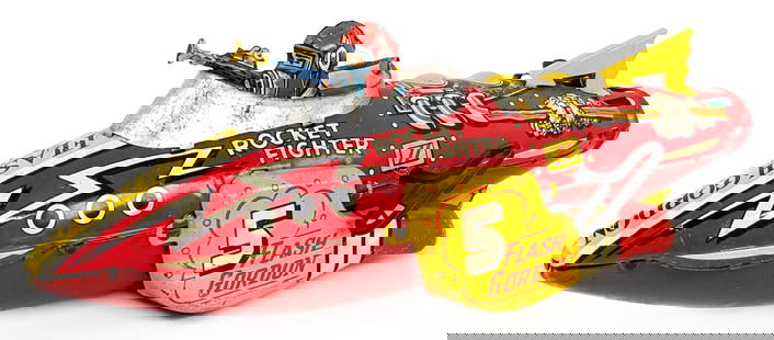 Marx Tin Windup Flash Gordon Rocket Fighter Ship: Marx tin litho windup Flash Gordon Rocket Fighter space ship. The rear tailfin on the ship was replaced. The windup mechanism works and the sparkler works. The toy has some scratches and average play